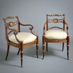 Coppia di poltrone aperte in stile Reggenza a grana e doratura a pacco