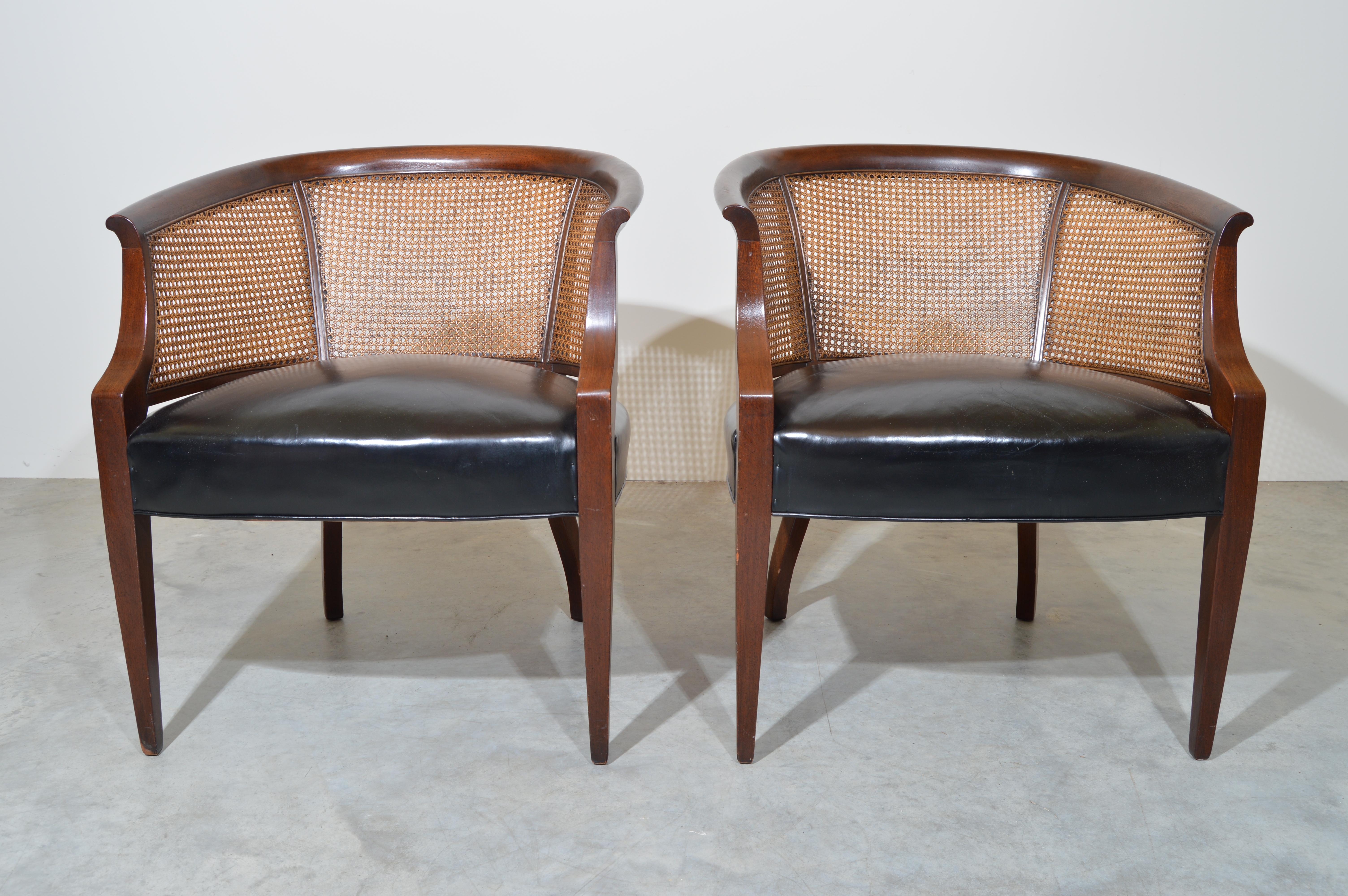 A beautiful matched pair of cane barrel back club chairs with lithe front legs by Hickory Chair Co. having beautiful, supple original leather. 1966 production. 
Beautiful, clean condition. No breaks or punctures to any of the caning. All in perfect