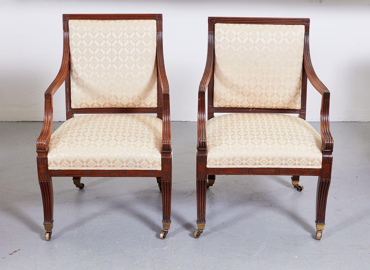 Fine pair of Regency period armchairs, the square backs with reeded crest ending in Greek key motif, the arms, back rails, seat frame and legs similarly treated, the latter having saber form ending in original box castors, ready for reupholstery.