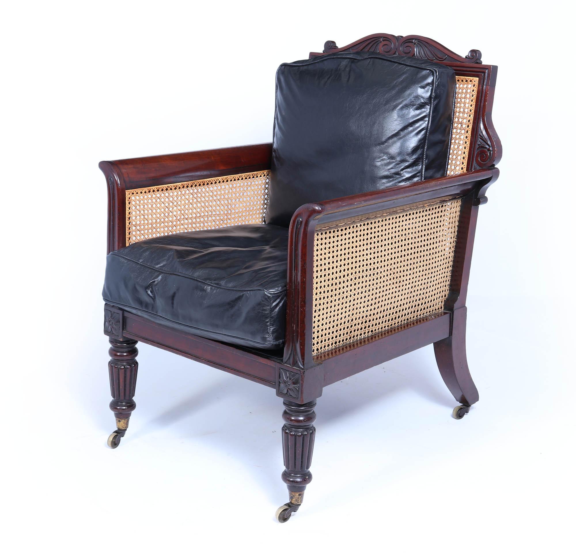 Pair of Regency Library Chairs Attributed to Gillows of Lancaster 
These exceptional Regency mahogany bergere library arm chairs, attributed to Gillows of Lancaster and crafted in England around 1830. These magnificent armchairs harmonious blend of