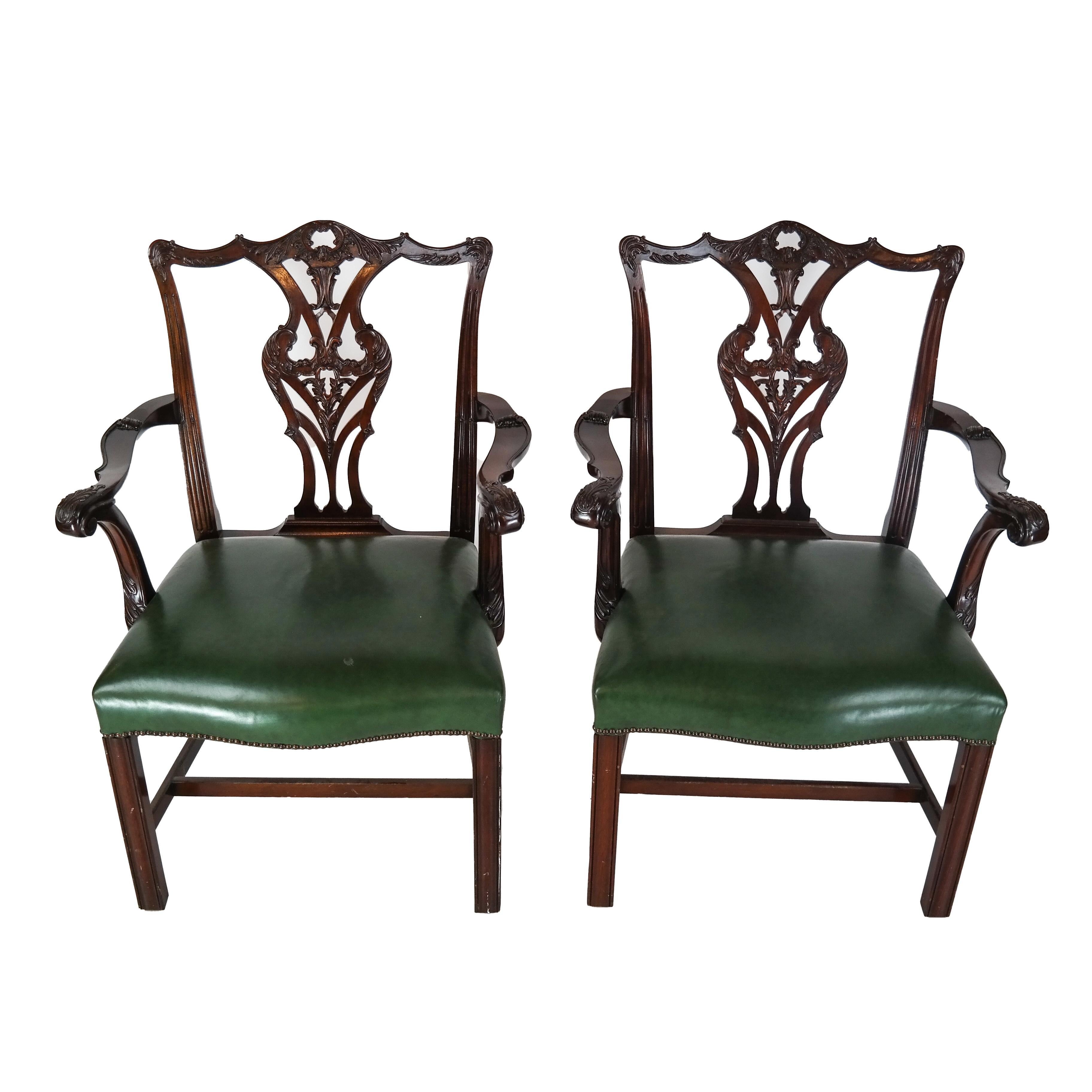 Pair of Regency mahogany arm chairs with green leather seats