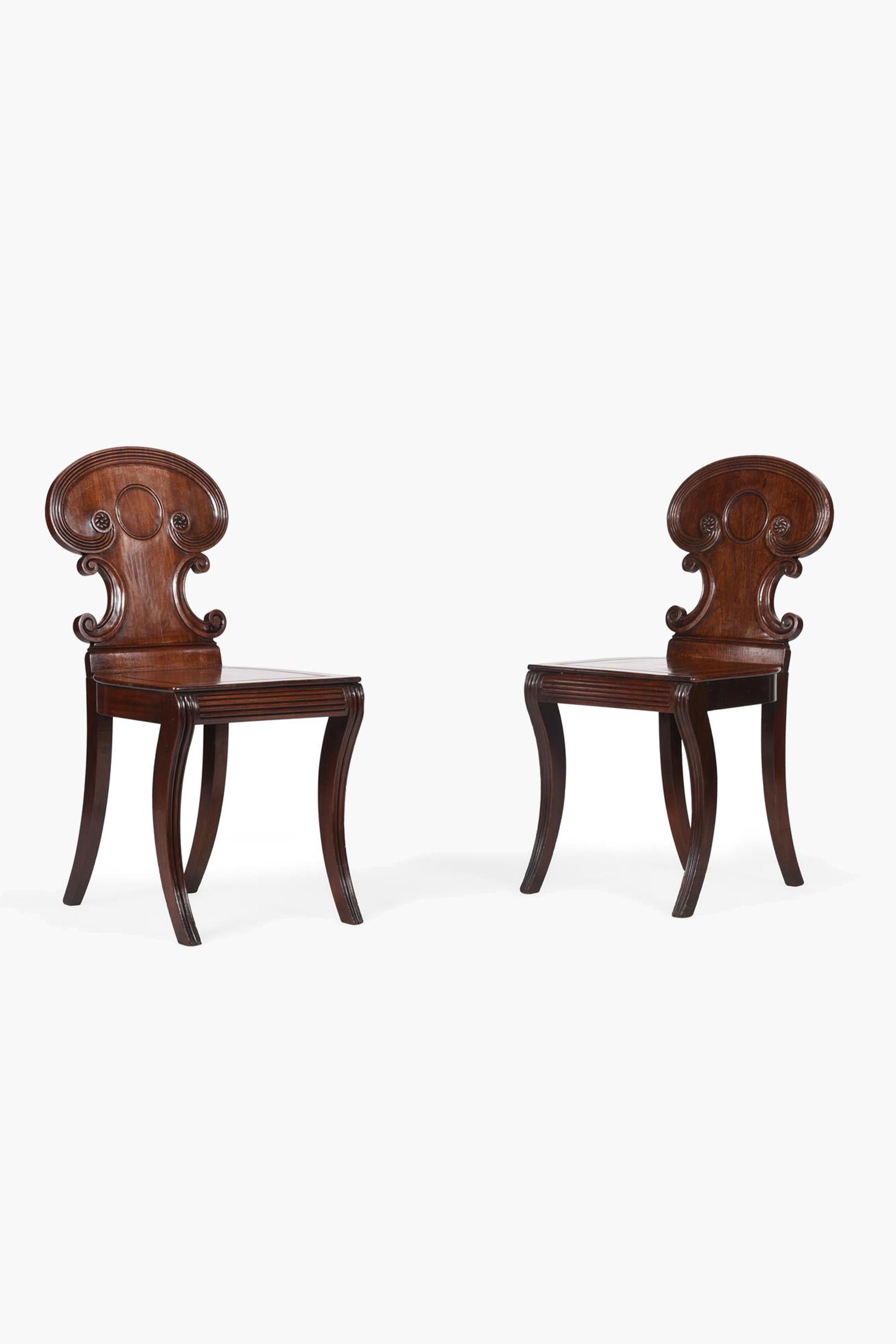 A PAIR OF REGENCY MAHOGANY HALL CHAIRS ATTRIBUTED TO GILLOWS, c. 1815

For a related mahogany hall chair see Susan E Stuart, Gillows of LANCASTER and LONDON 1730-1840, Antique Collectors' Club, 2008, p203, pl177, whilst the upper back of plate 177