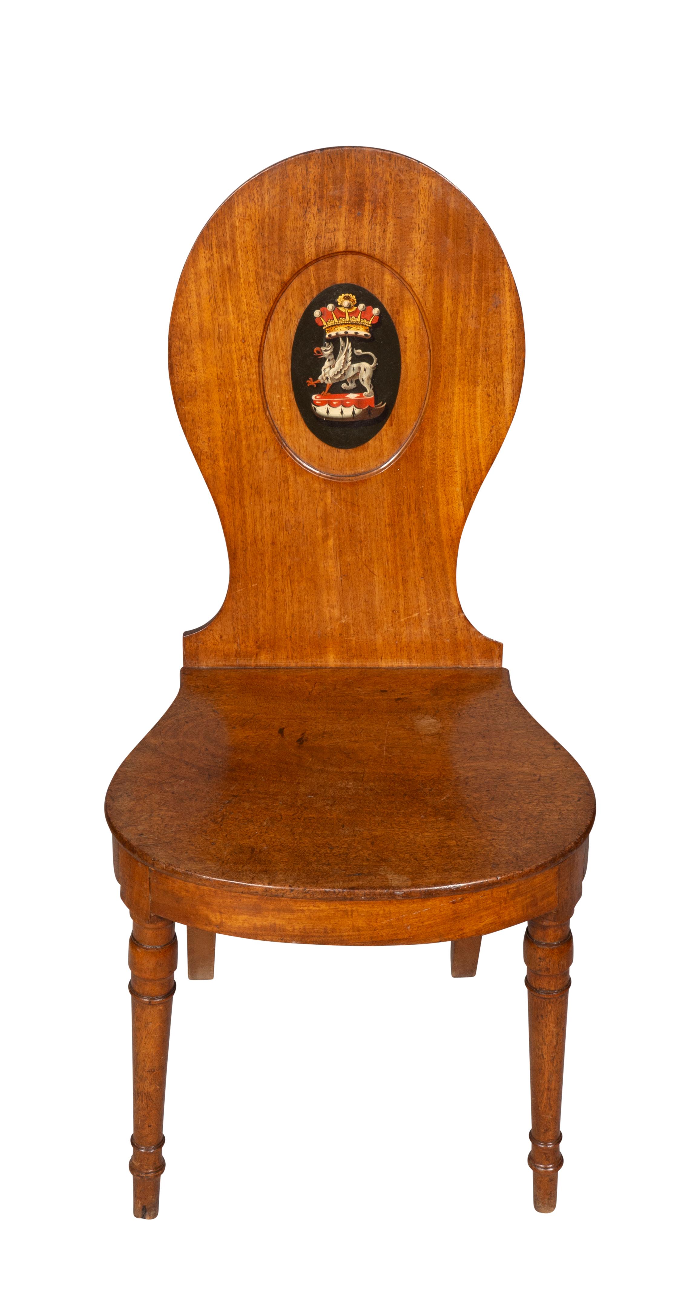 Each with oval backs with centrally painted crest. Bowed seat raised on circular tapered legs.