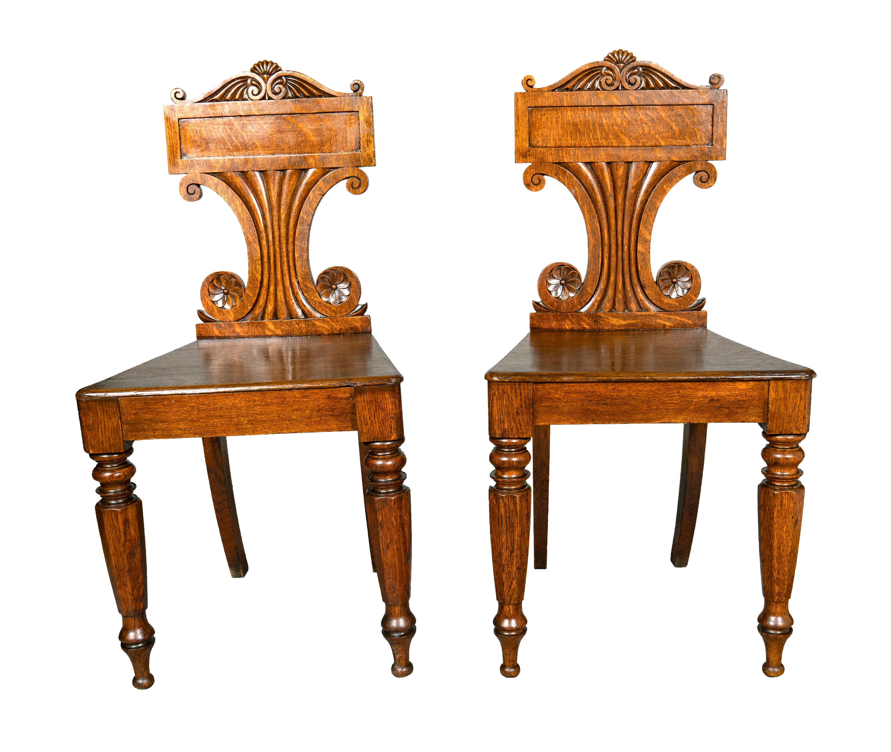 Each with tablet back and vitruvian scroll carving, reeded tapered splat. Solid wood seat raised on circular tapered legs.