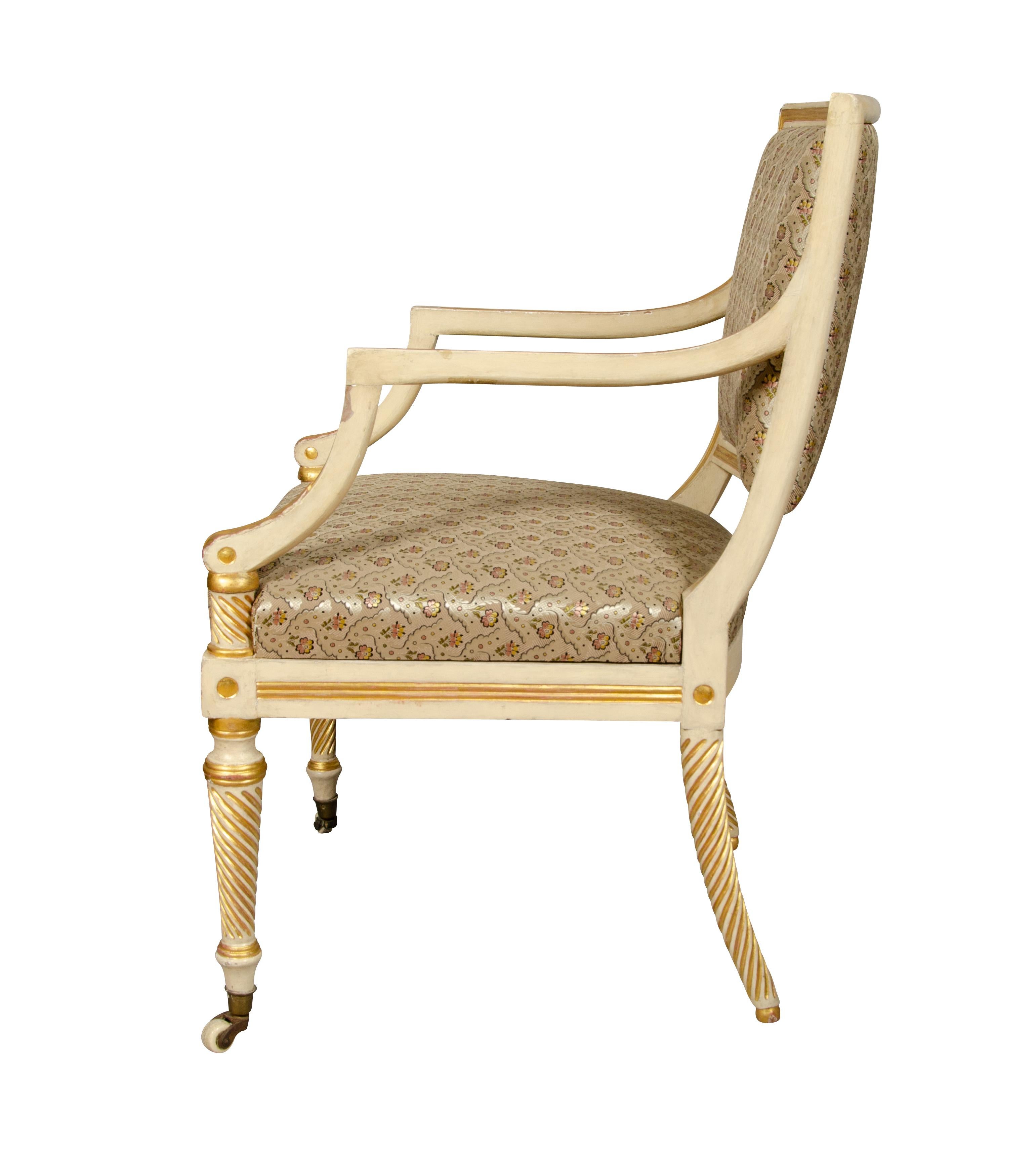 Comfortable with useable upholstery, sturdy , square back and seat raised on circular tapered legs with spiral gilded fluted design. Casters.