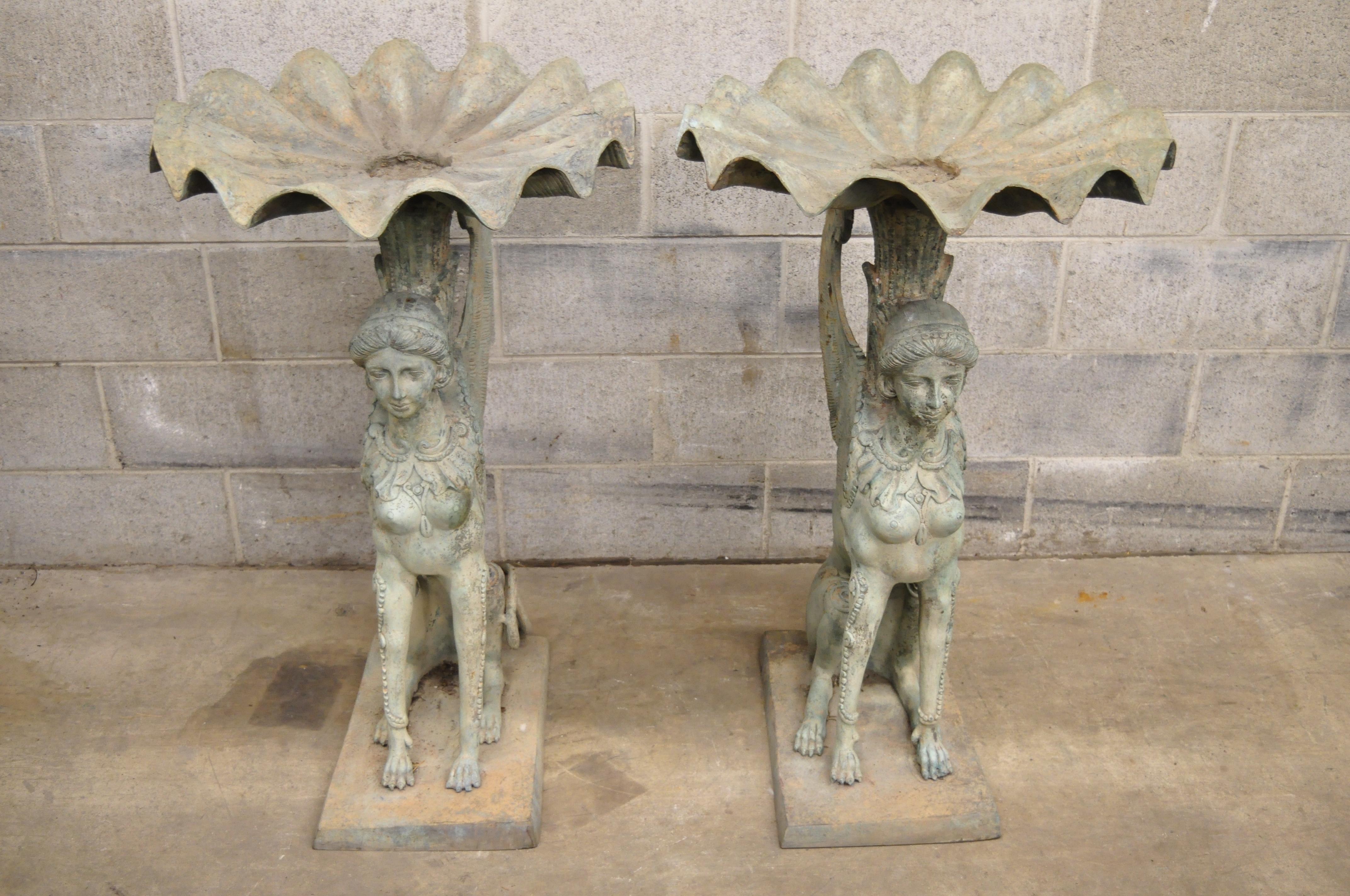 Pair of Regency style patinated bronze figural maiden sphinx garden pedestal fountains. Listing includes heavy patinated solid bronze forms. Approximate 105 lbs each, circa late 20th century. Measurements: 37