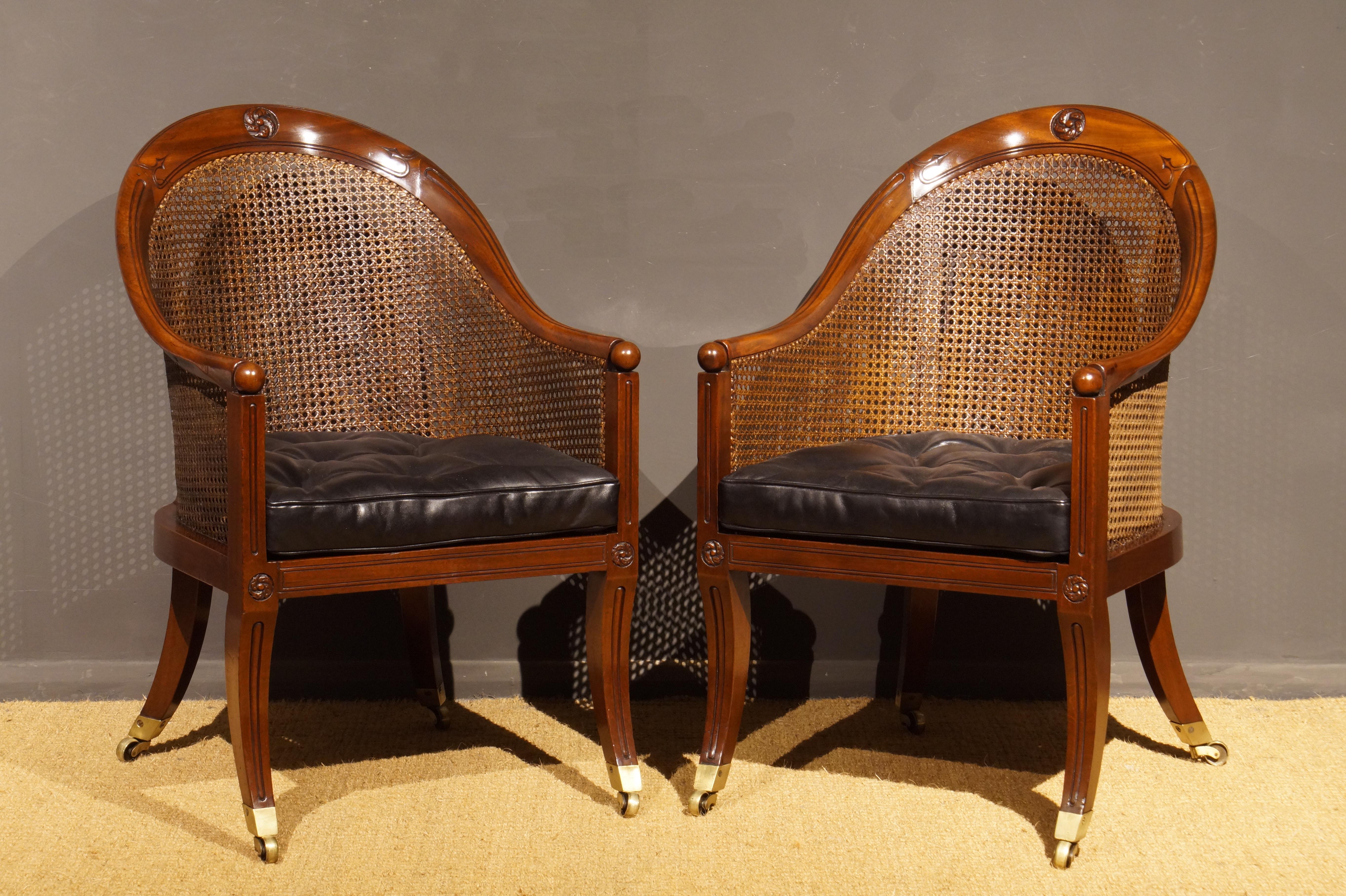 Leather Pair of Regency Period Mahogany and Caned Library Bergeres For Sale