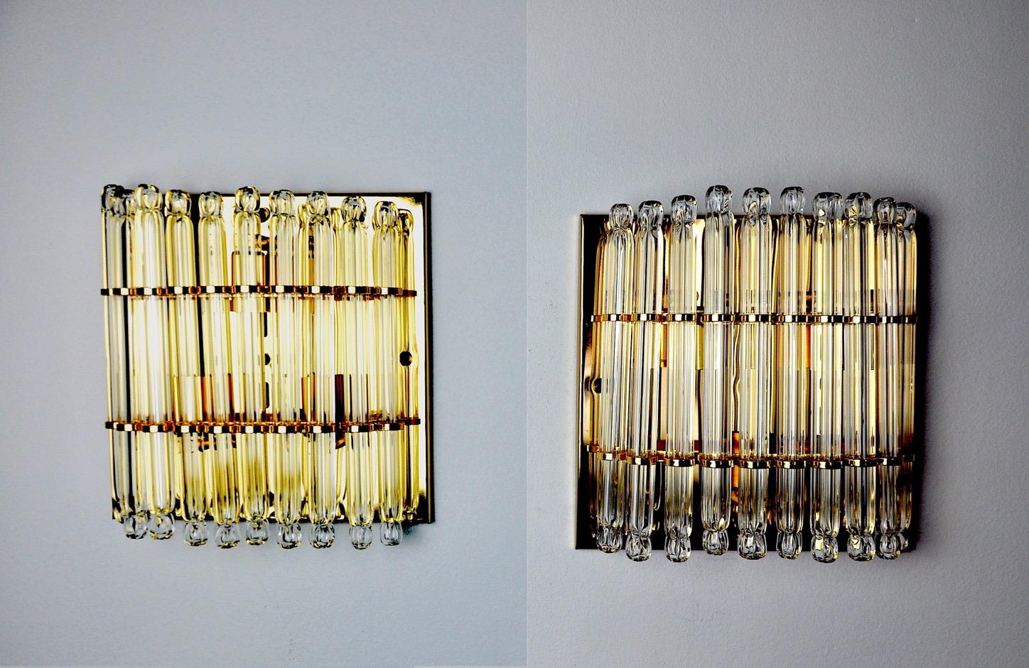 Very nice and large pair of triedi wall lights from the 70s. Cut glass and gilt metal structure. Unique object that will illuminate and bring a real design touch to your interior. Electricity checked, wiring not visible behind the structure, easy