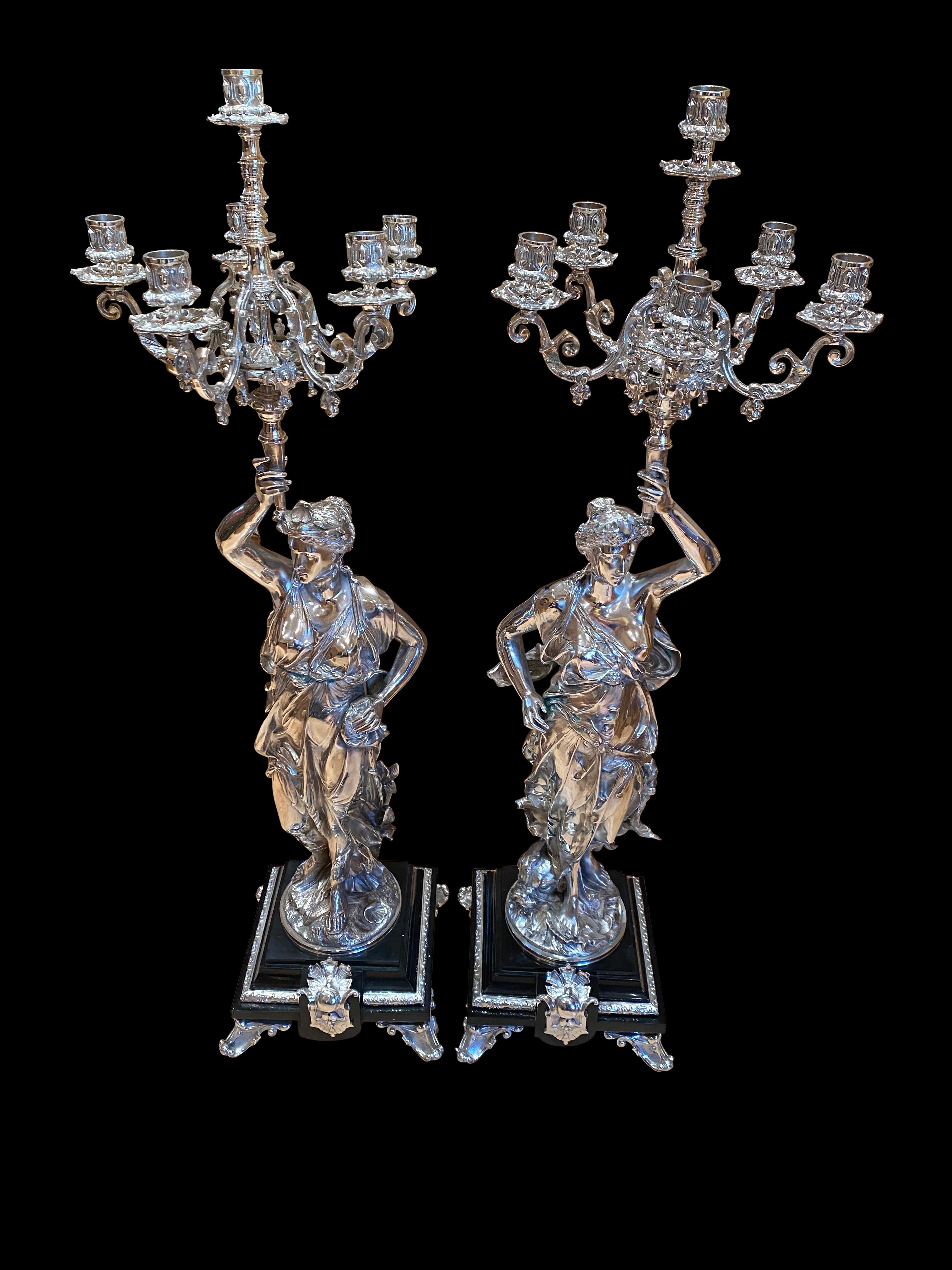 A stunning pair of Regency silver plate cherub candelabras, 20th century. Very eye-catching pair, perfect left and right. Great patina to the silver plate. Great collectors piece, and suitable for any home.