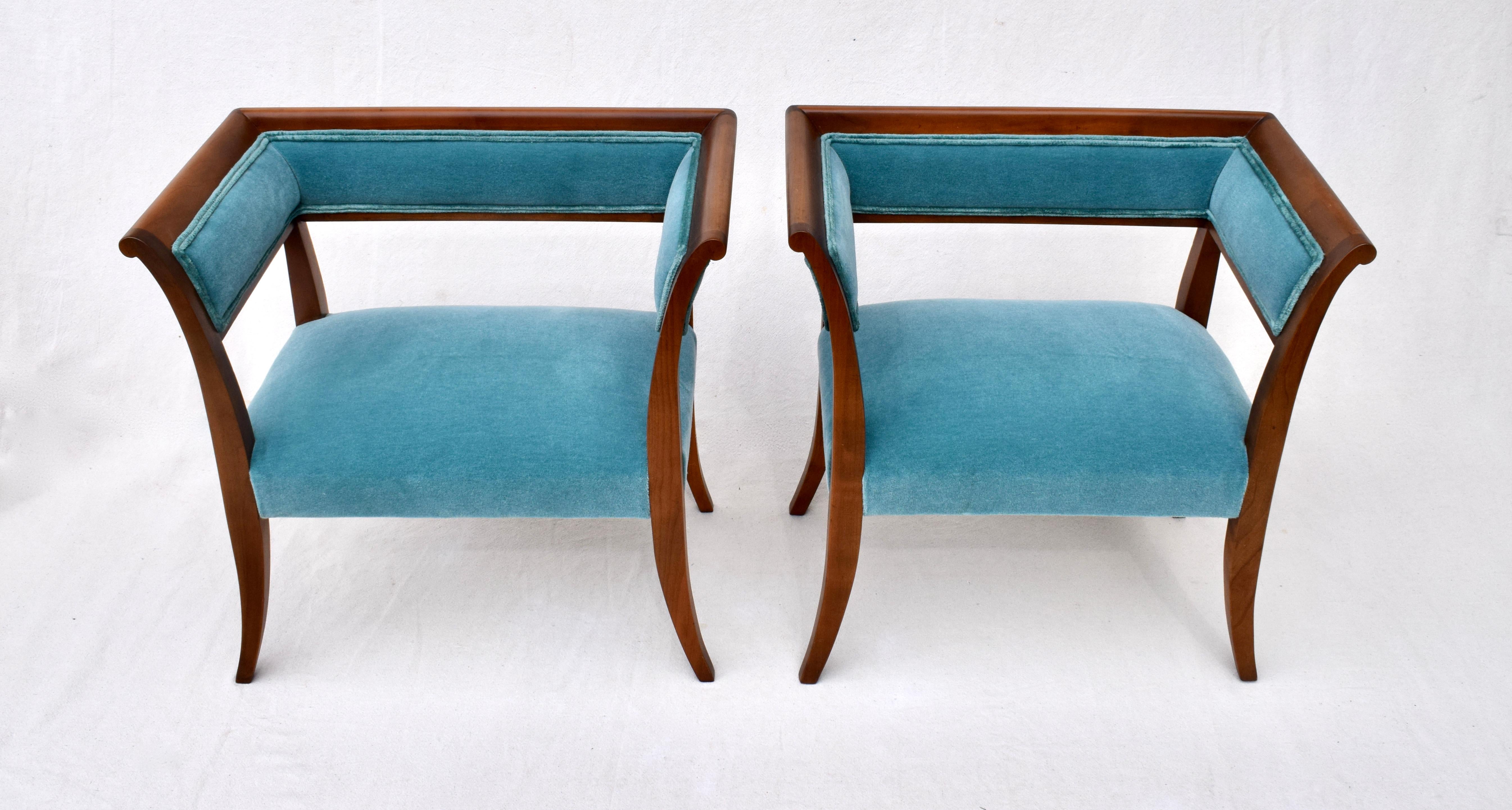 An elegant pair of Regency stools or benches upholstered in teal Mohair.
Solid wood construction with Klismos styling. Branded 