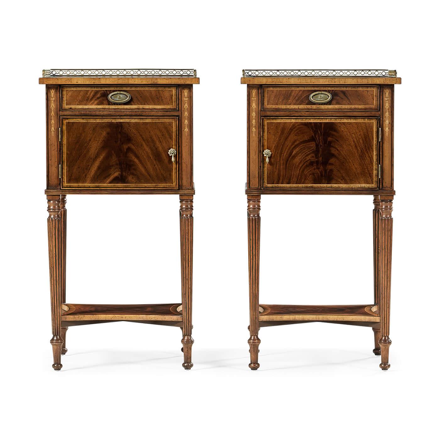 Pair of Regency style mahogany veneered and crossbanded bedside cabinets with a pierced patinated brass rail, single drawer and cupboard, and raised under-tier. Tapering fluted legs and fine floral marquetry work to the paneled uprights.