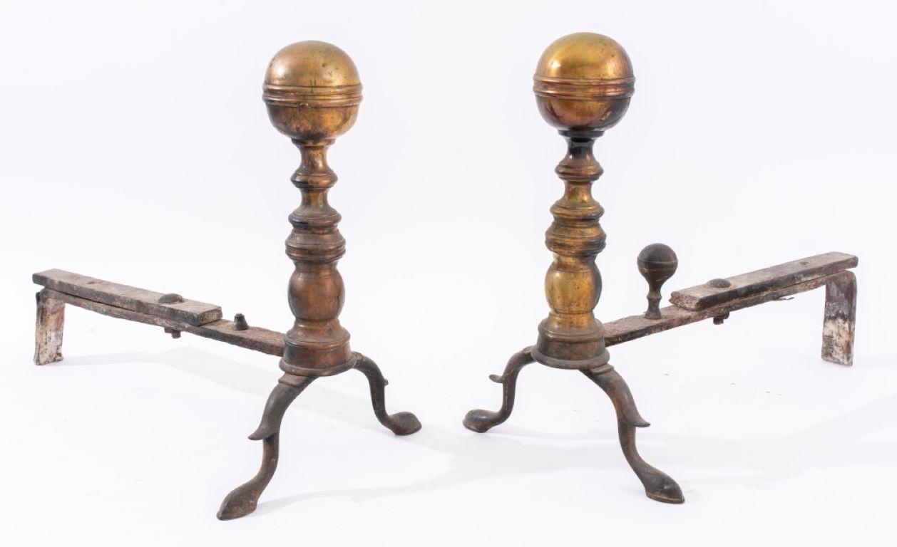 Pair of Regency style brass cannonball fireplace andirons or chenets. 

Dealer: S138XX