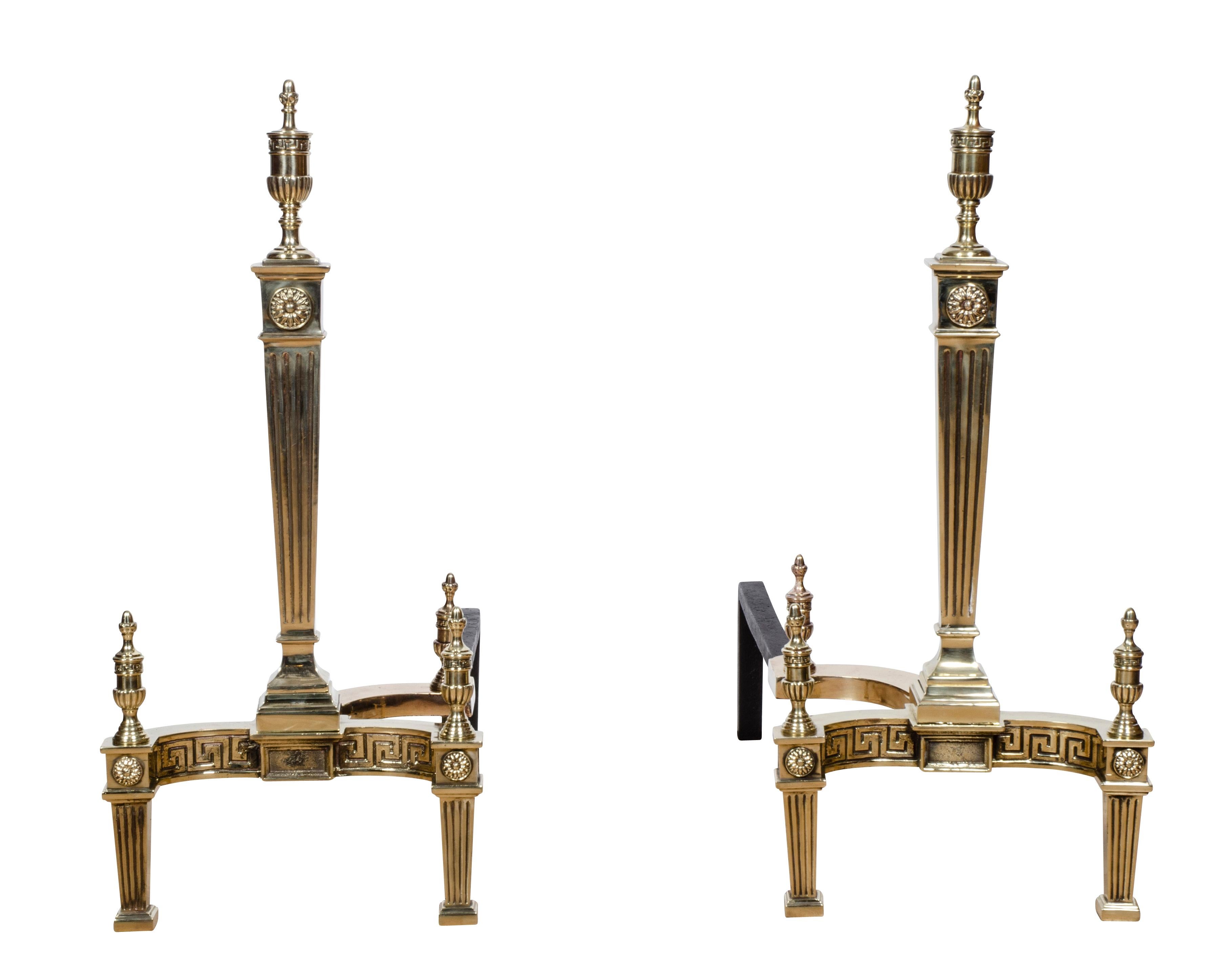 Each with finials, tapered square reeded columnar column, curved base with tapered reeded legs. These andirons sat in the fireplace of 