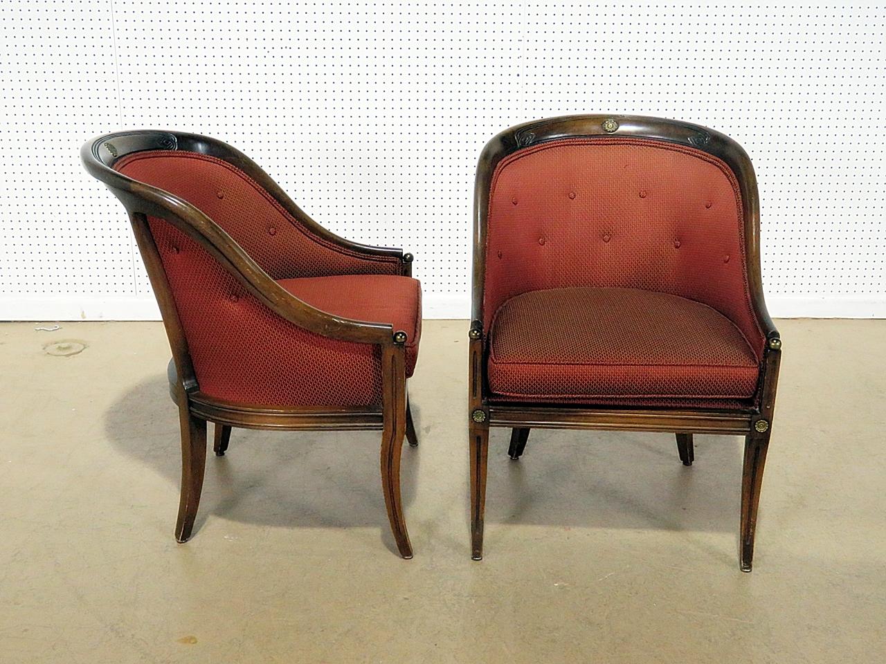 Pair of Regency style club chairs with metal accents.
