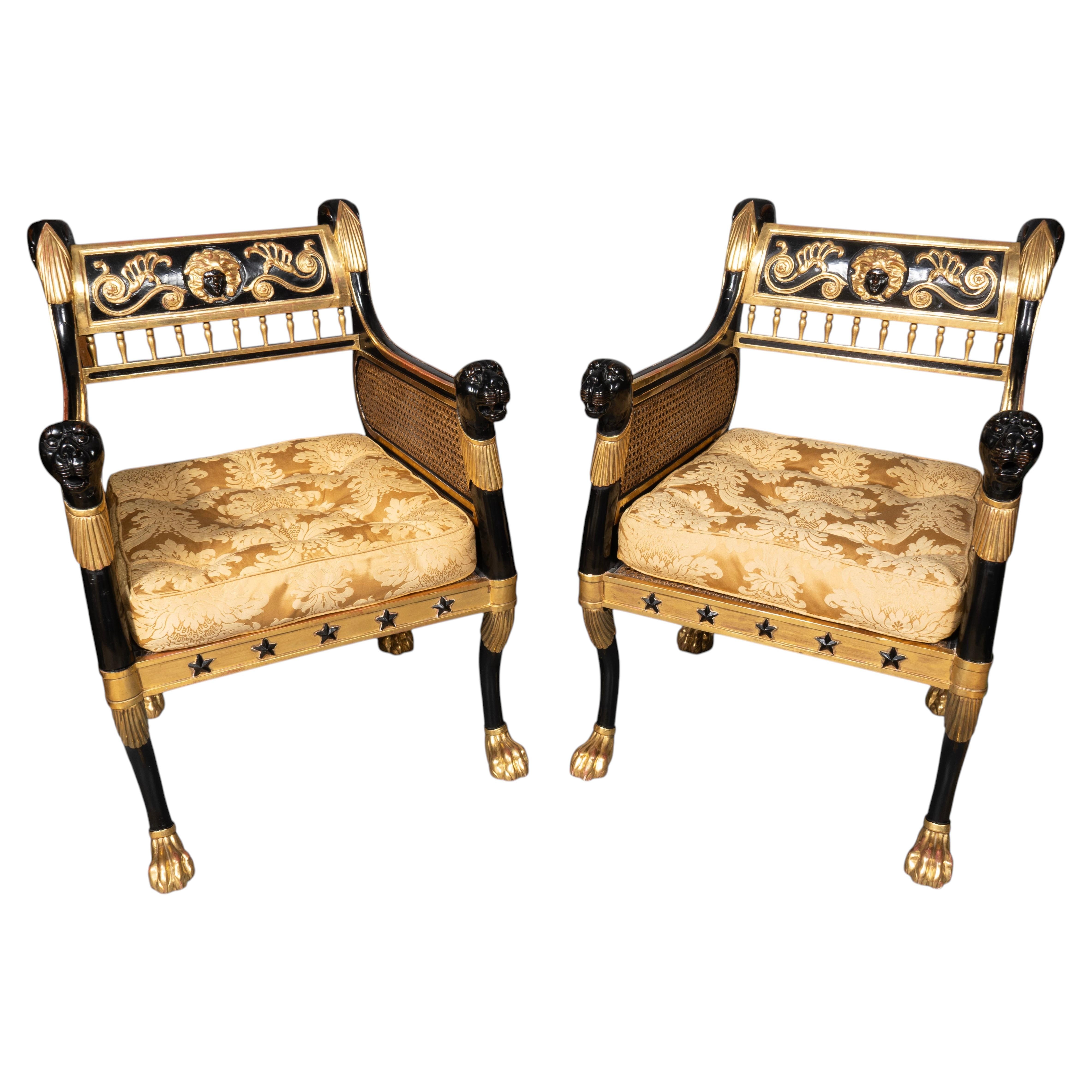 Pair Of Regency Style Ebonized And Parcel Gilt Armchairs For Sale