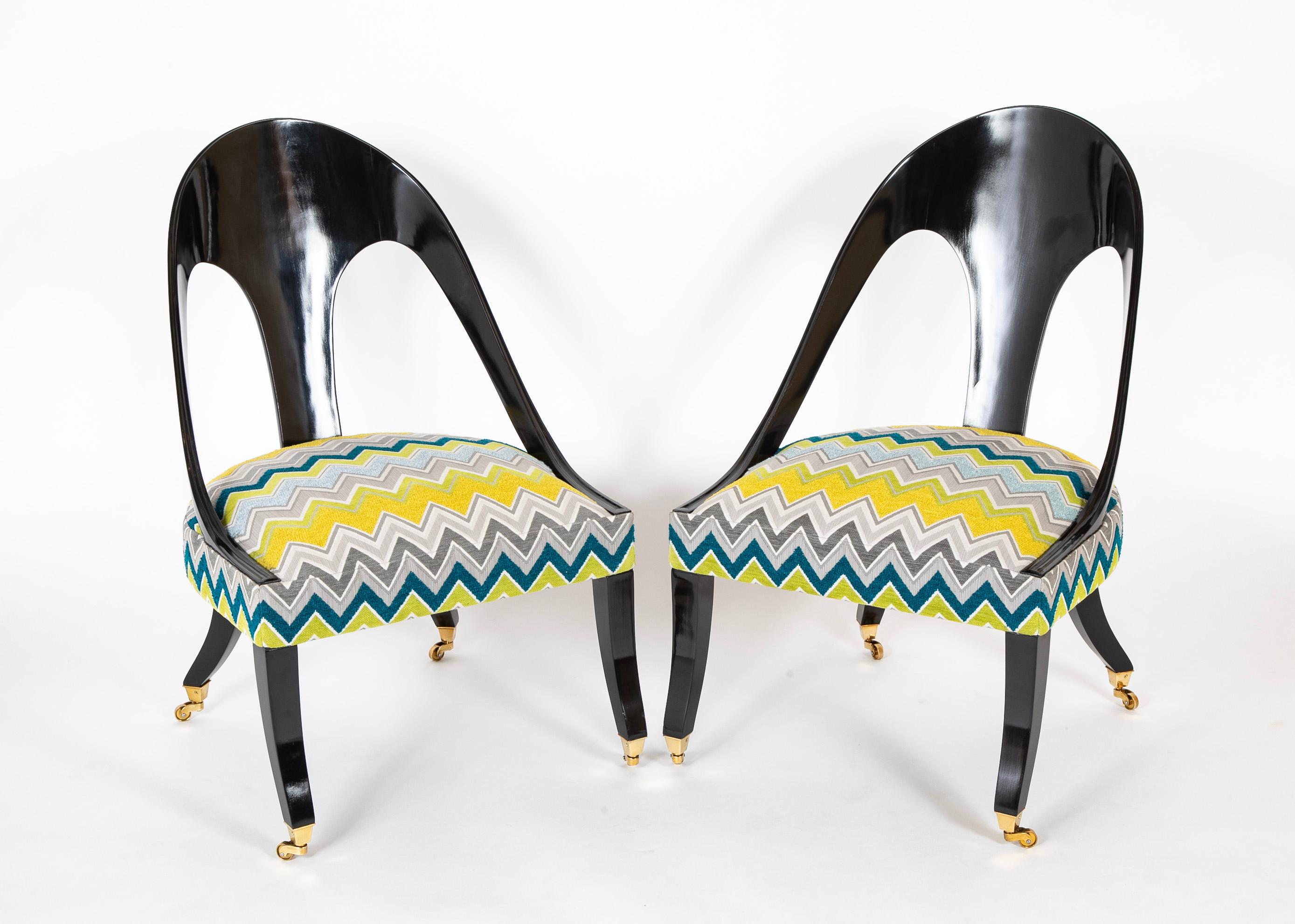 Pair of Regency style ebonized spoonback chairs.  Mid 20th Century.
