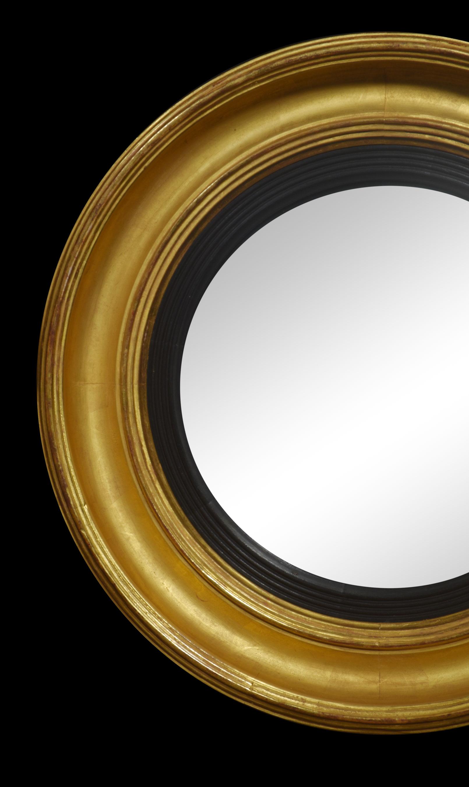 Pair of regency wall mirrors of circular form caving carved giltwood frame and central original convexed mirror encased in ebonised frame. There is some slight pitting to the mirrors consummate with age.
Dimensions
Height 19.5 Inches
Width 19.5