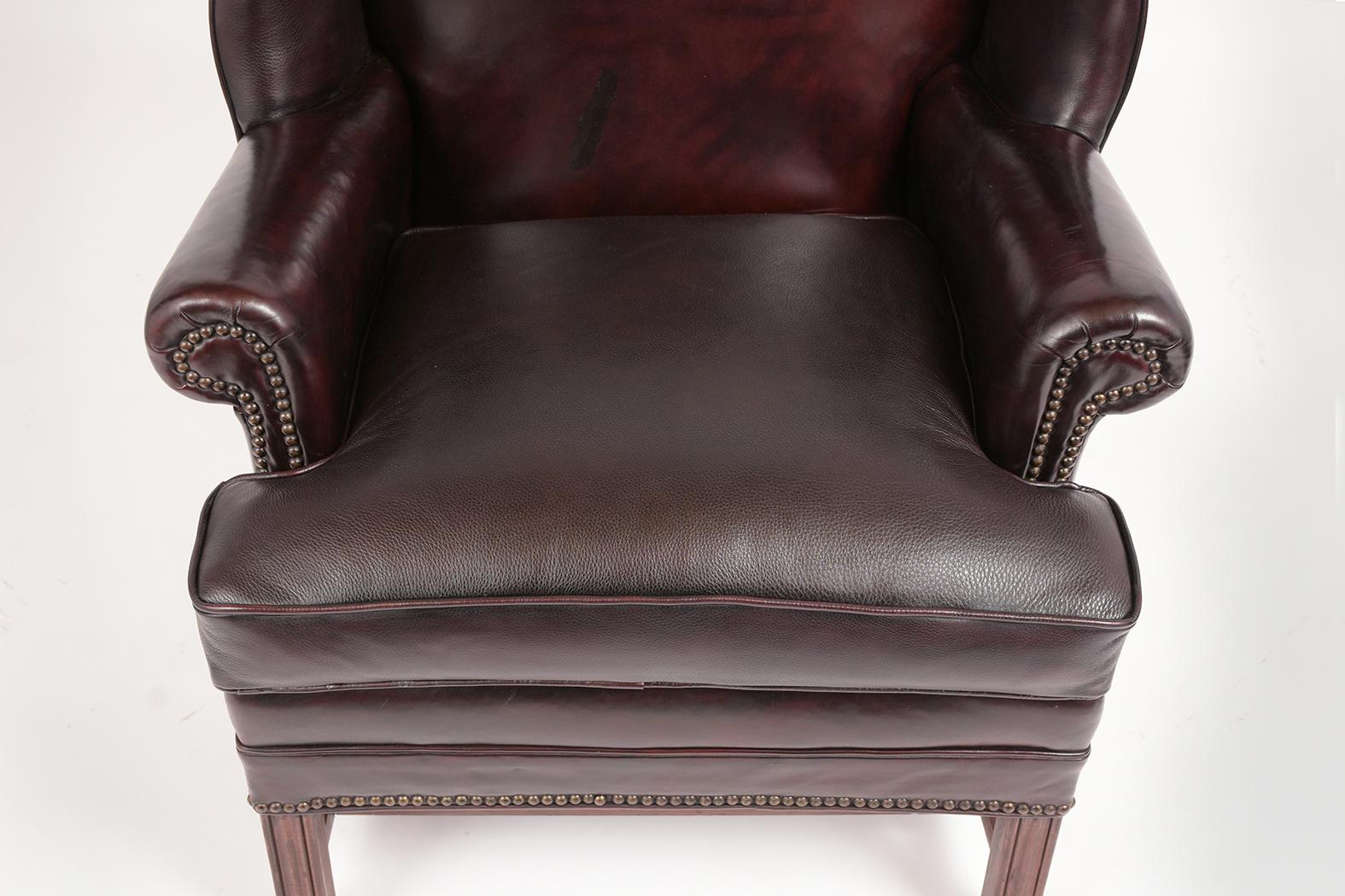 Carved Pair of Leather Wingback Chairs