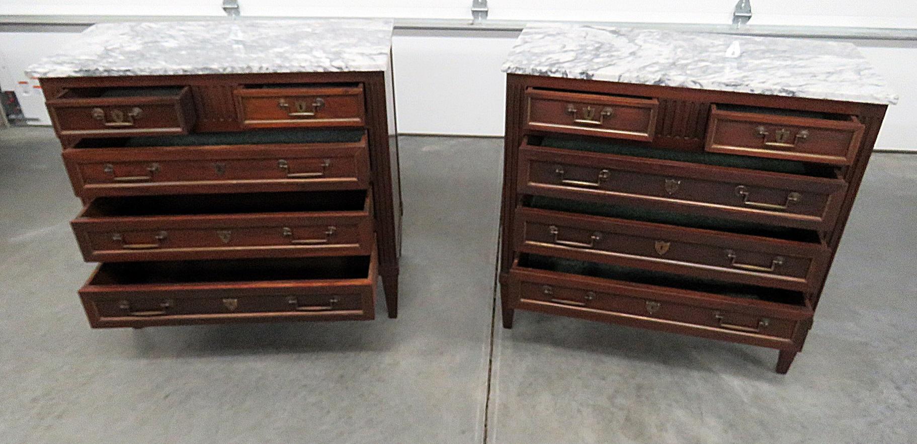 Pair of Jansen style marble-top five-drawer commodes.