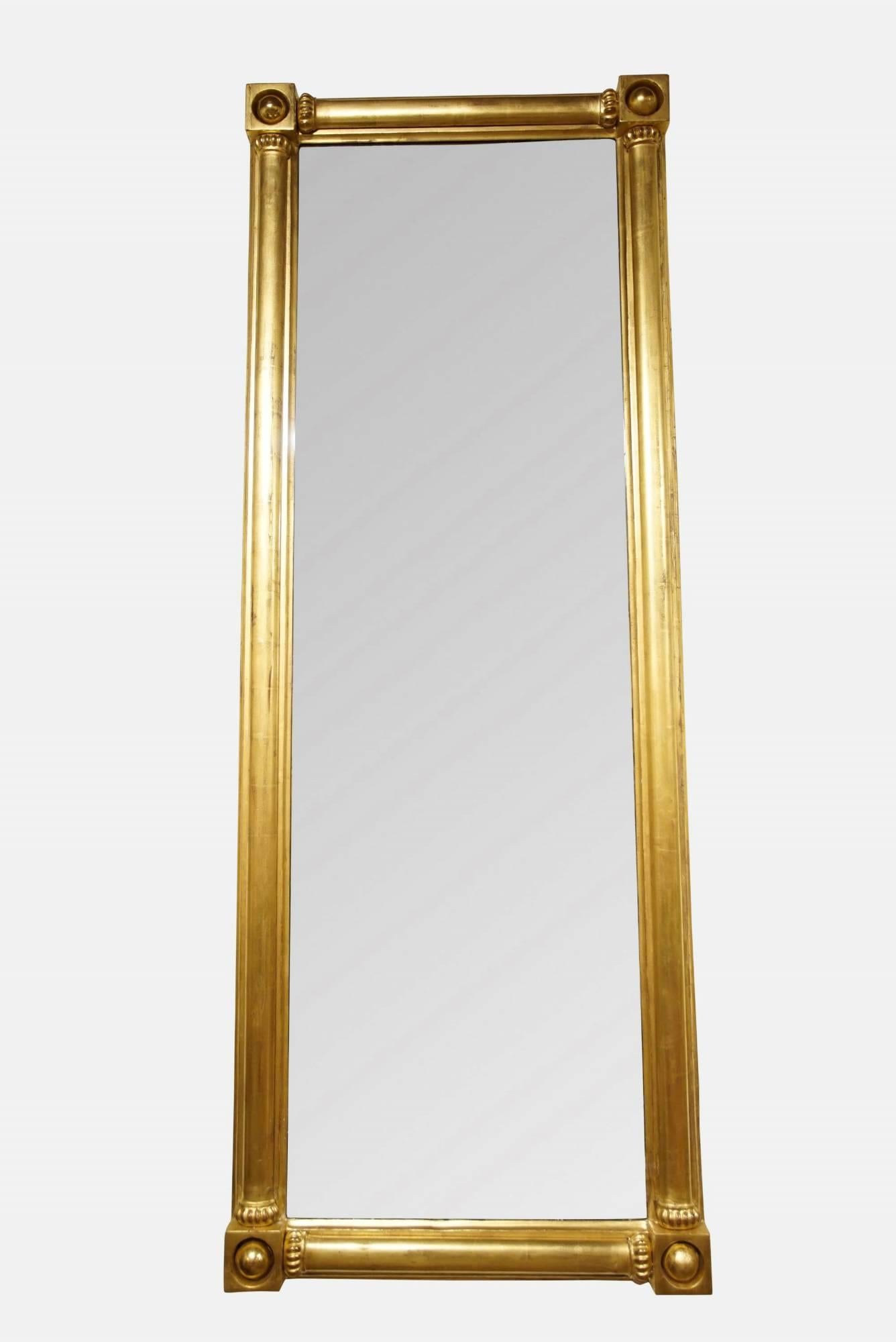 A pair of Regency style gilded pier mirrors with corner ball decorations,

late 20th century.