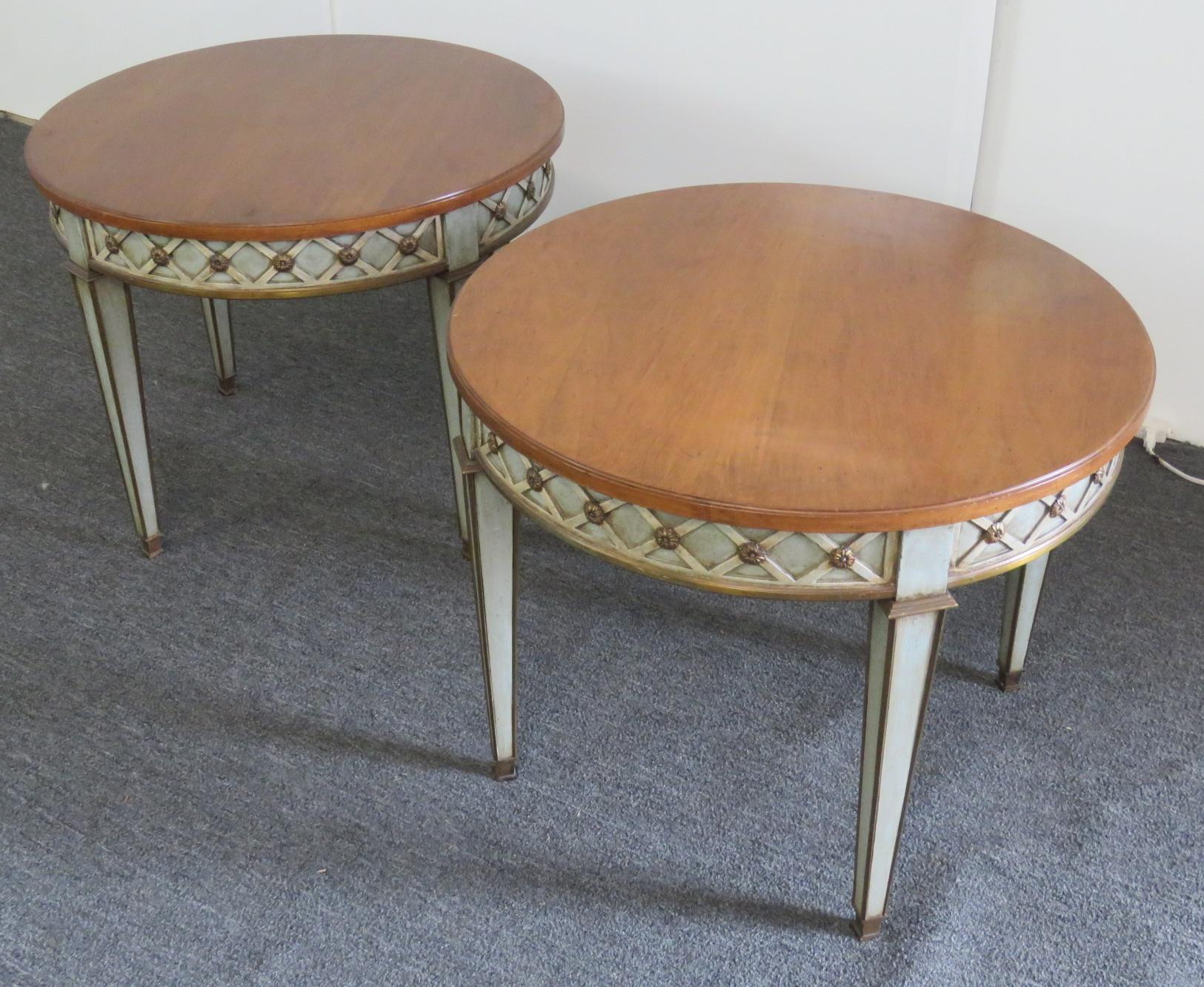 Pair of Regency style distressed paint decorated side tables by Trouvailles of Watertown, Mass. These are in good condition and have finely carved frames and a beautiful color combination.