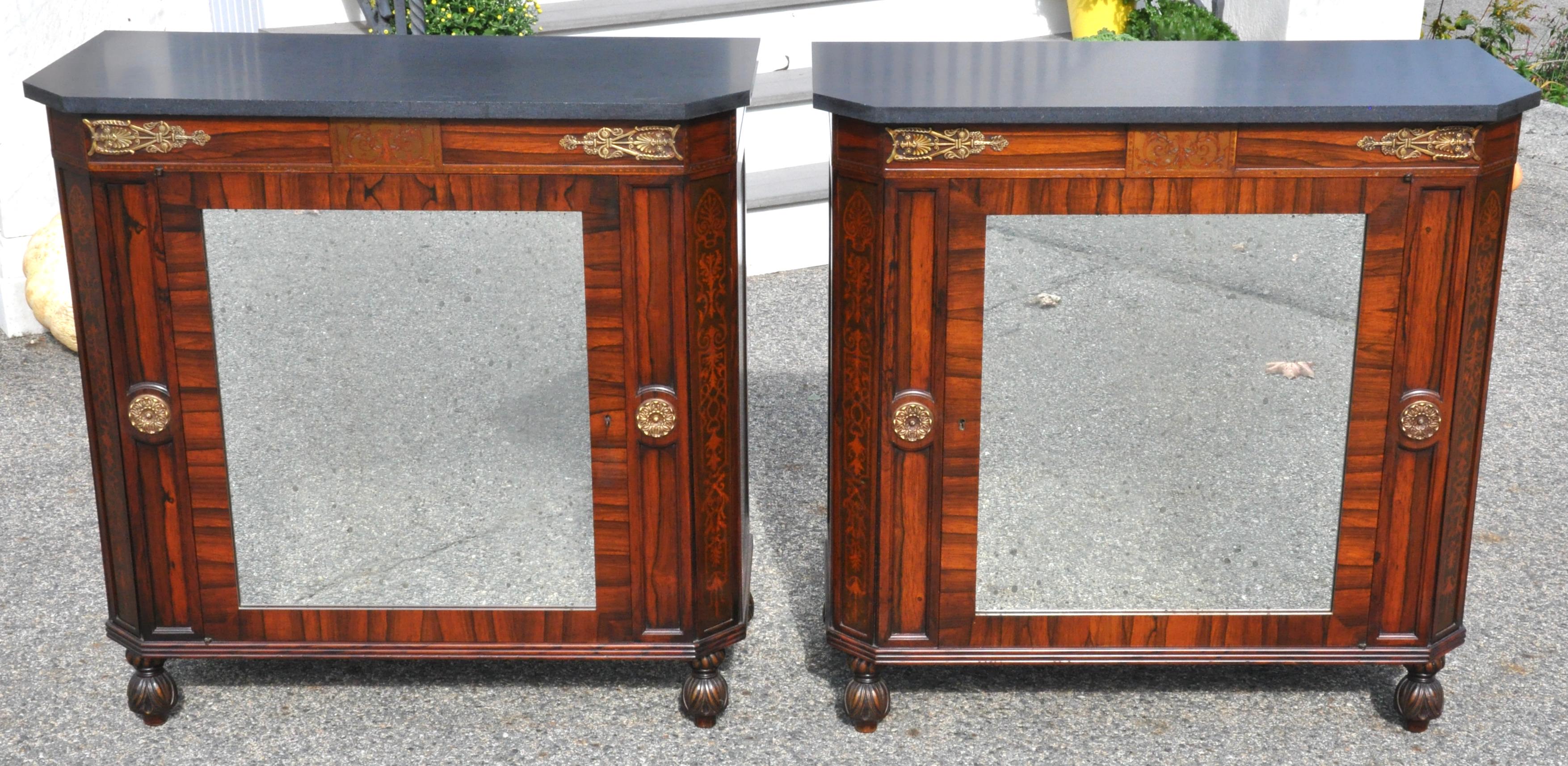 Pair of Regency style rosewood and inlaid marble top side cabinets. Mirrored door reveal rosewood shelves. Carved feet.