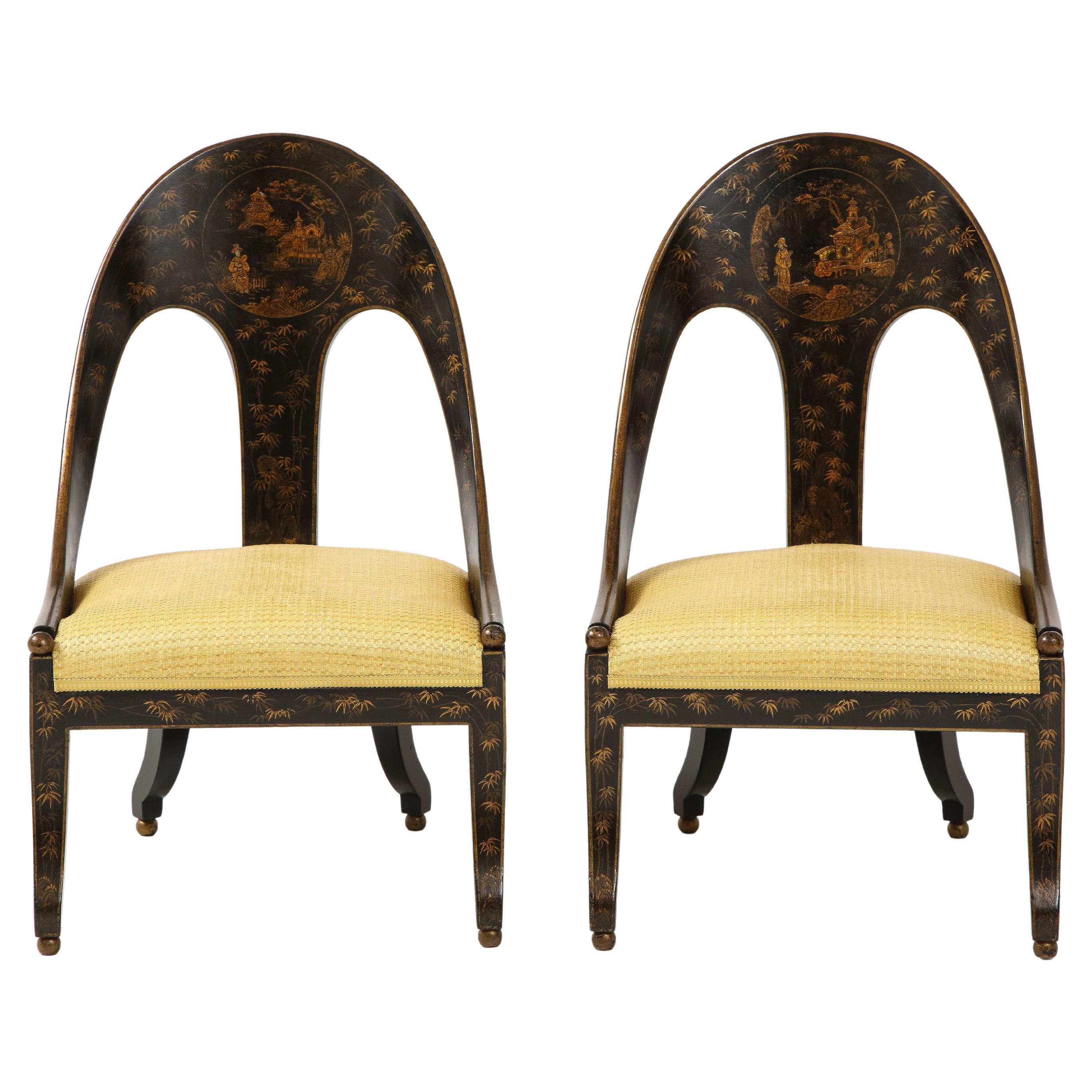 Fine pair of chinoiserie decorated Regency style spoon chairs of typical form, the curved backs with central round panels with figures, buildings and bridges in a landscape setting, the ground decorated with shooting and flowering bamboo stands, the