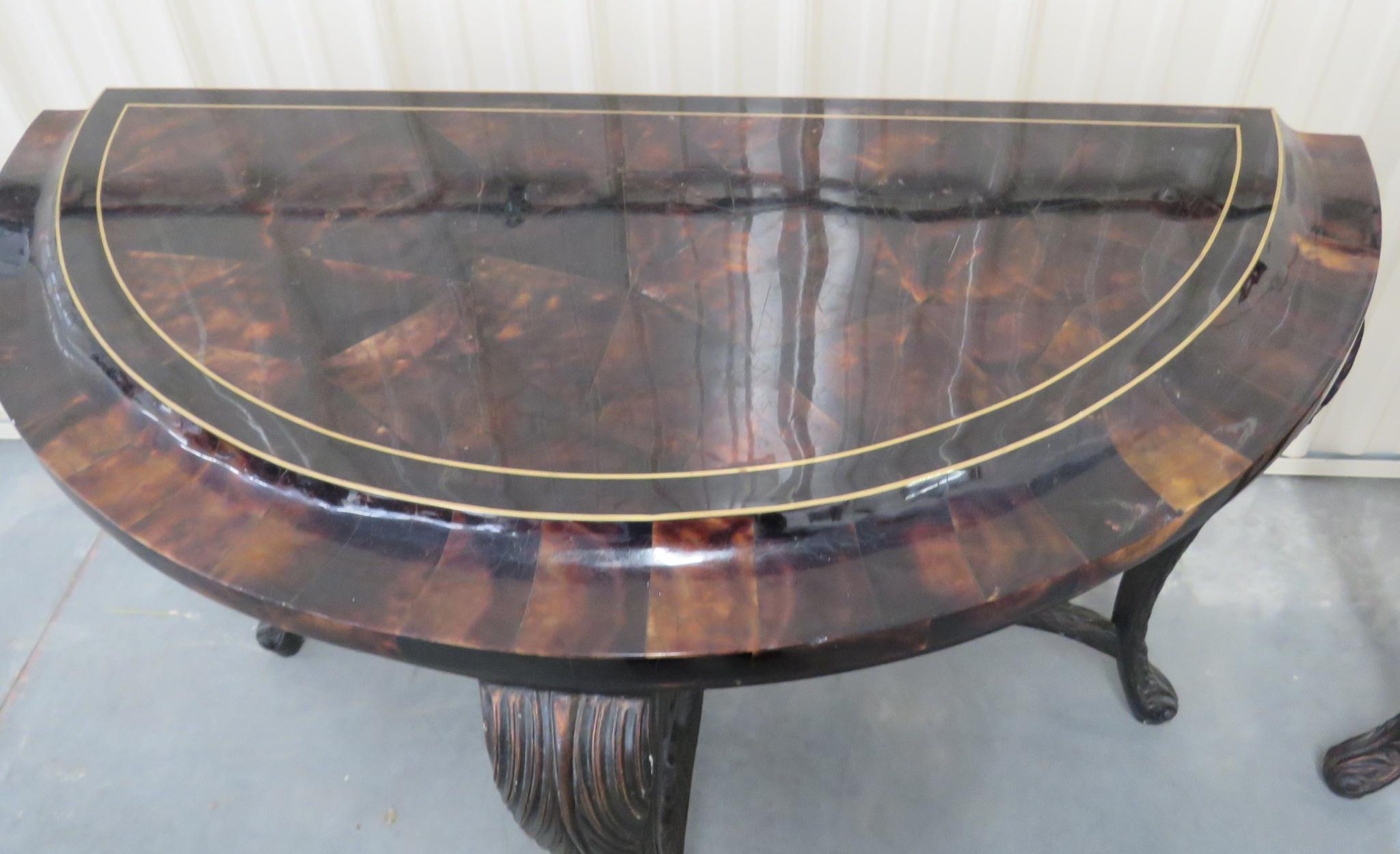 These are absolutely amazing tables made with tasselated tortoise shell and carved walnut frames depicting acanthus leaves and carved swans on the base. The tables have a rich look and are certainly unique and one-of-a-kind. 