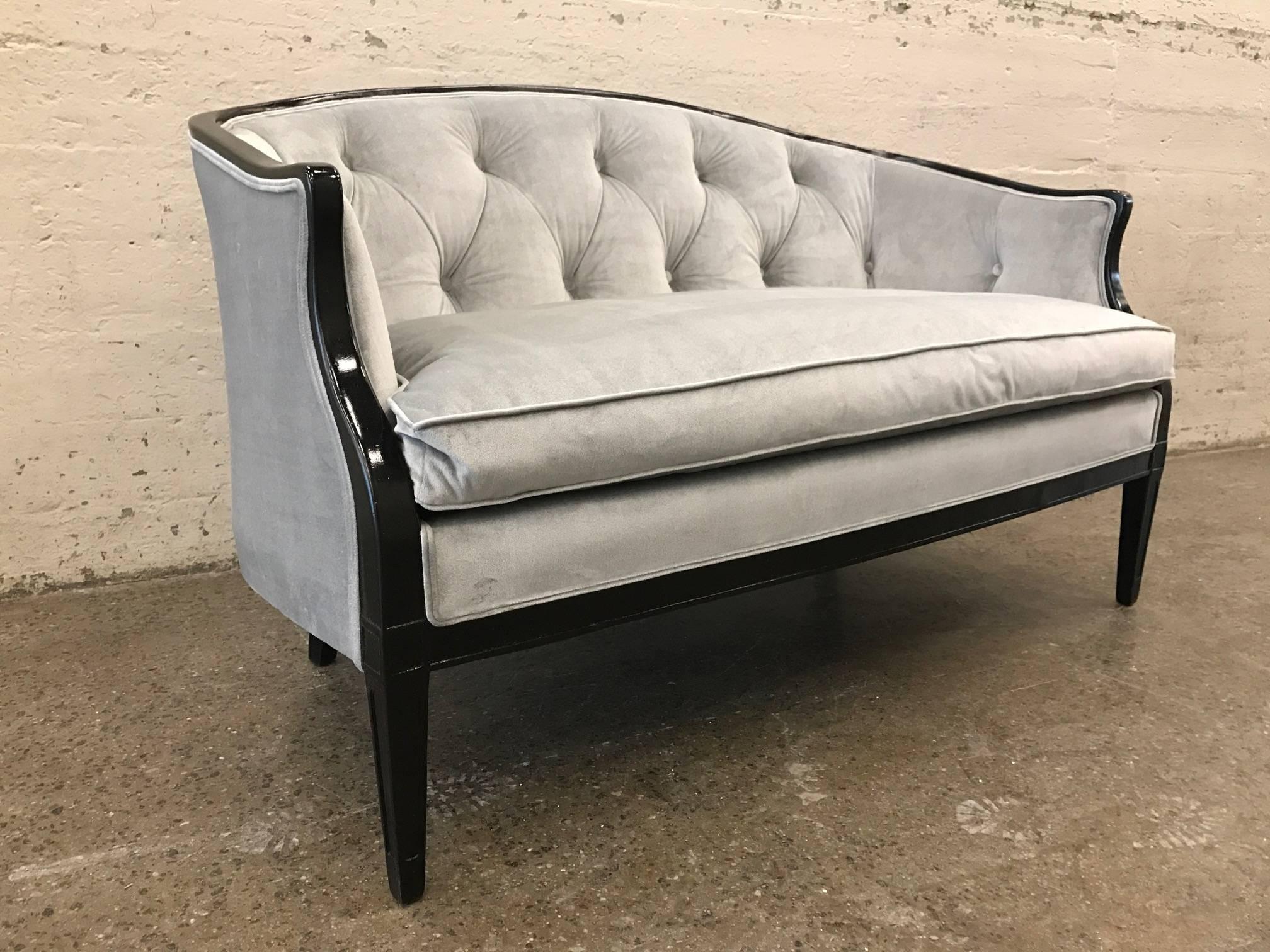 Pair of Regency style tufted back sofas. Upholstered in light gray velvet with black lacquered frame.