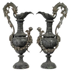 Pair of Regule Ewers on Marble Base.