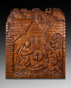 Coppia di pannelli in rilievo raffiguranti la Natività e l'Adorazione dei Magi