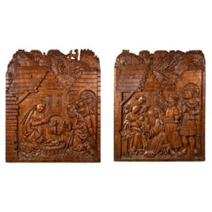 Coppia di pannelli in rilievo raffiguranti la Natività e l'Adorazione dei Magi