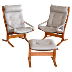 Pair of Relling Highback Siesta Chairs in Beige Leather with Matching Ottoman 