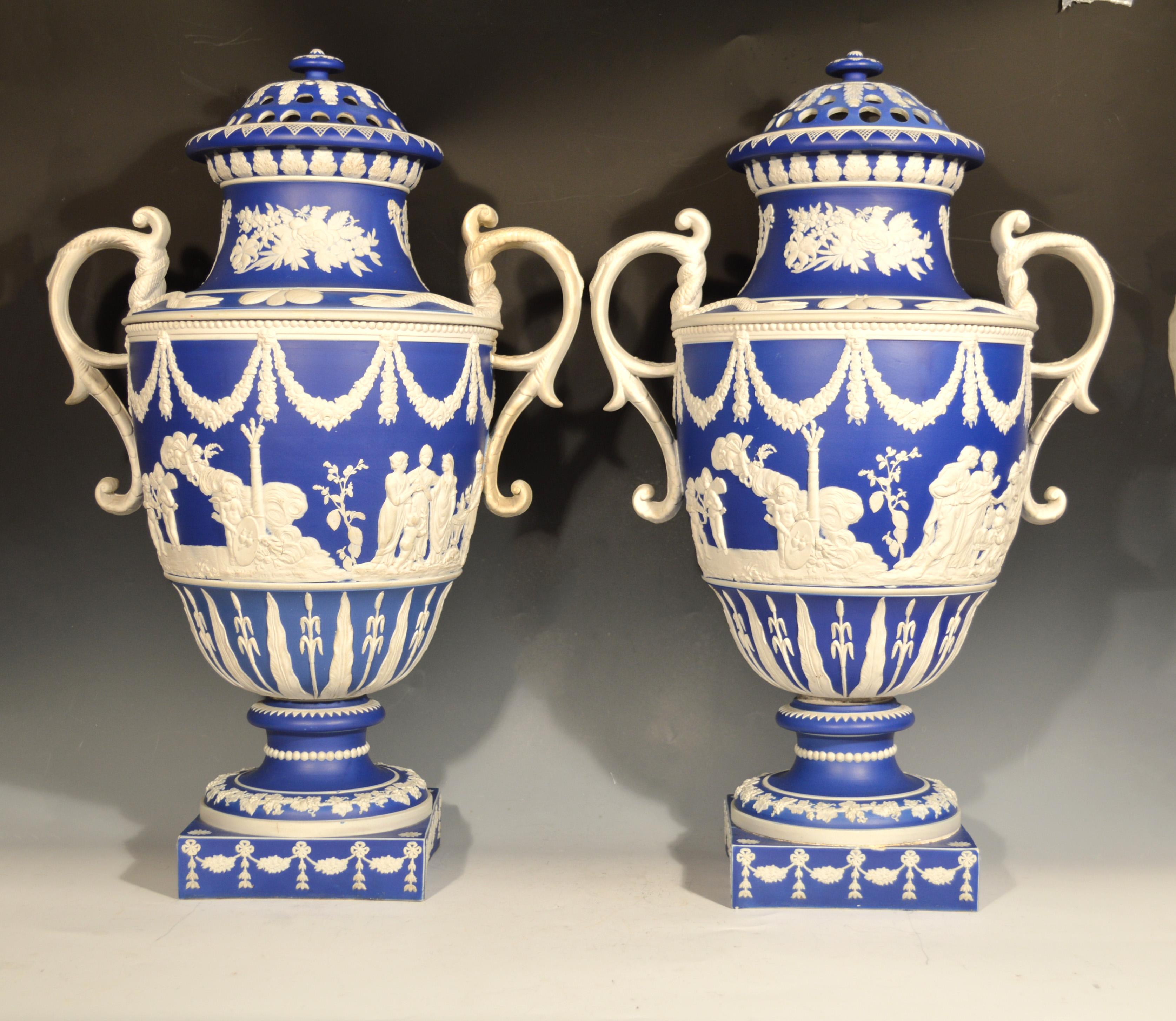Pair of remarkable blue Jasper dipped sprigged stoneware vases and covers,
Attributed to Neale & Co.,
early 19th century.

The ornate footed vases with a blue ground and with sprigged decoration. The vases with white scrolled handles encircled