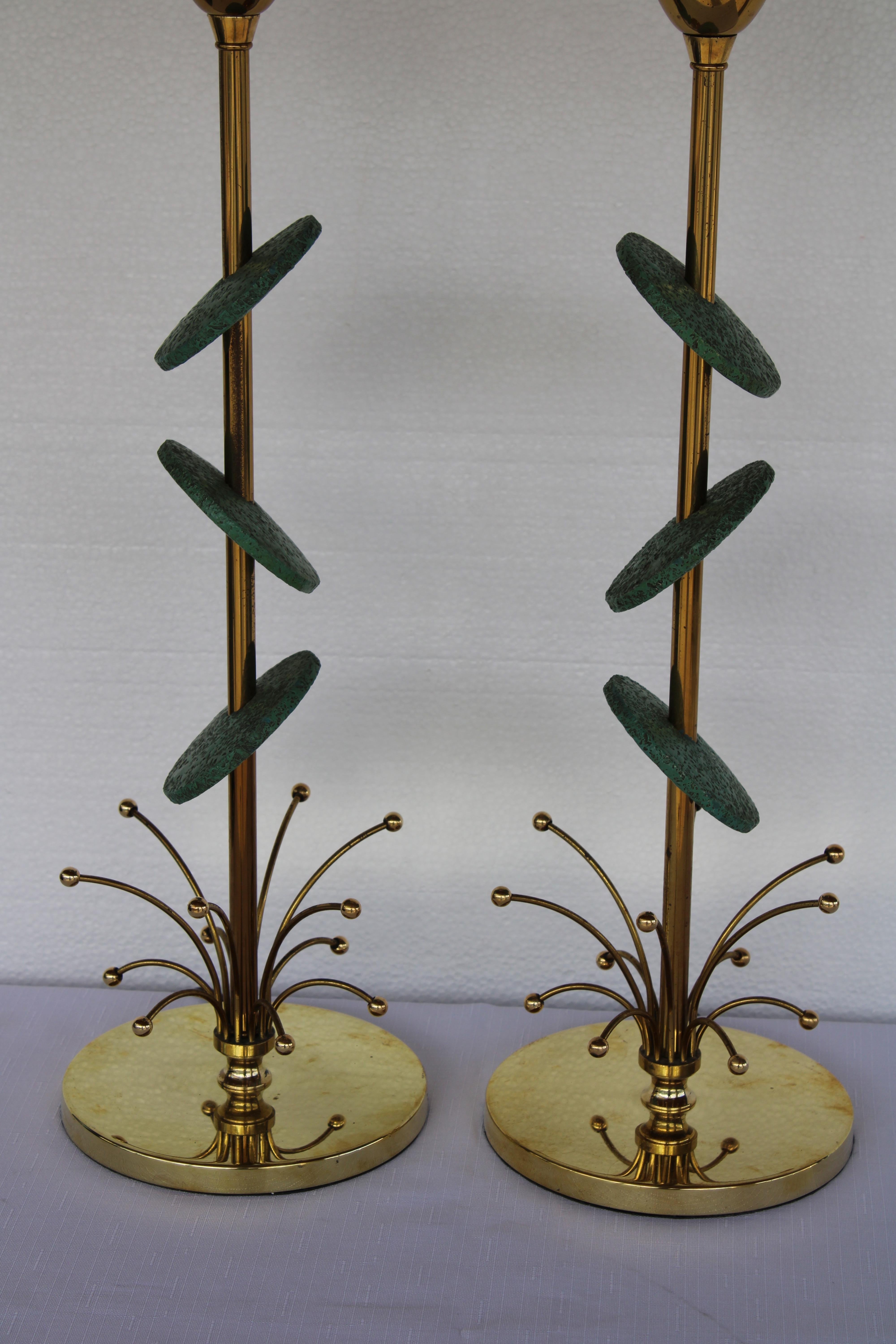 Pair of lamps by the Rembrandt lamp company, each with 3 green ceramic disks.  Each lamp measures 27.5