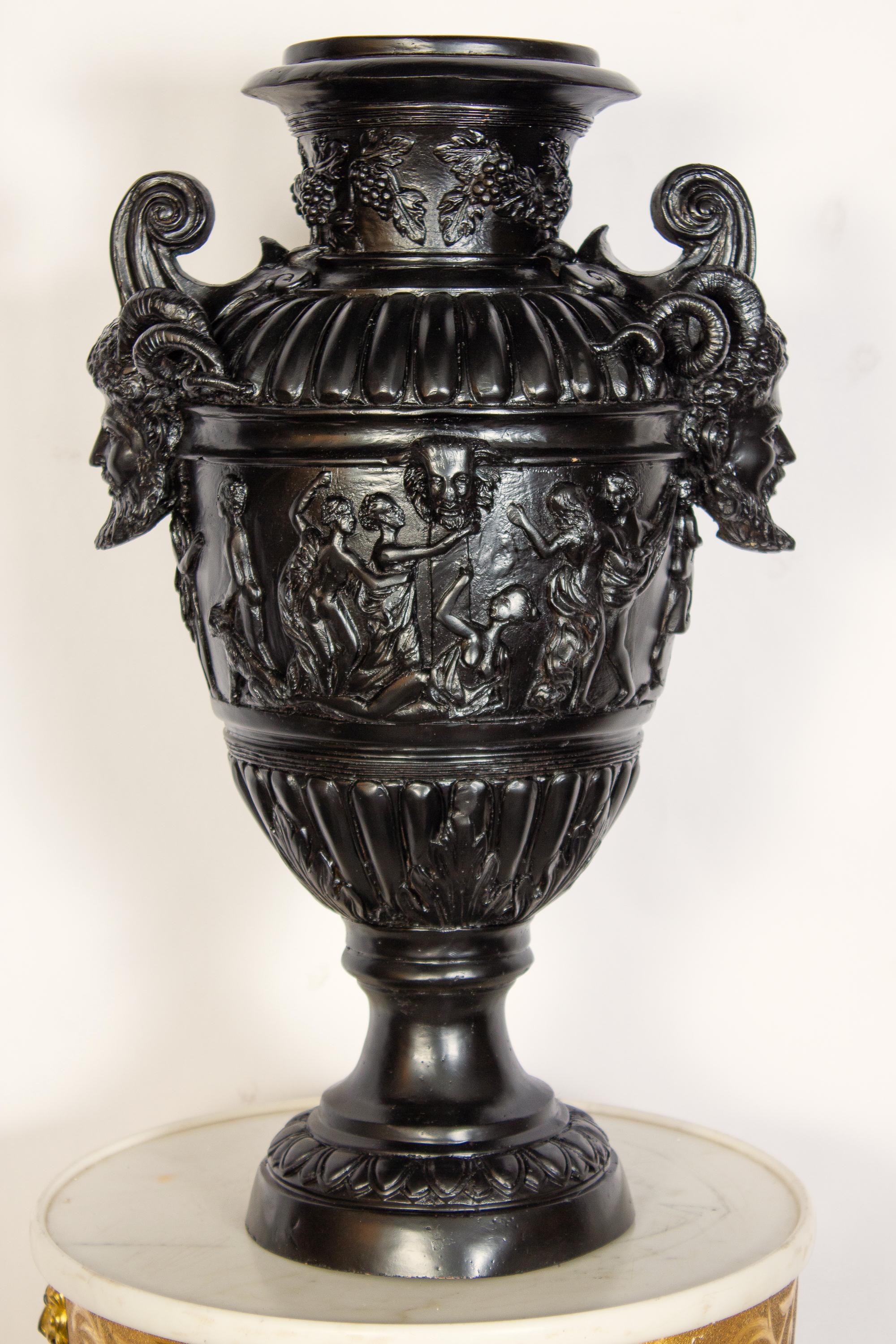 Impressive pair of black patinated bronze vases in the style of Renaissance. Finely decorated handles with a satyr figure, over with a and body surrounded by bacchanal scenes.
Exquisite decoration for your interior or garden.
 