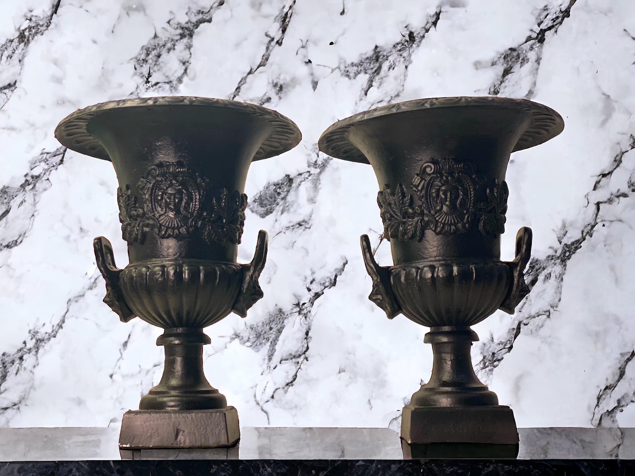 Impressive pair of black patinated bronze vases in the style of Renaissance. Finely decorated handles with a lion  figure, over with a and body surrounded by leaves and female mask.  
Exquisite decoration for your interior or garden.
 