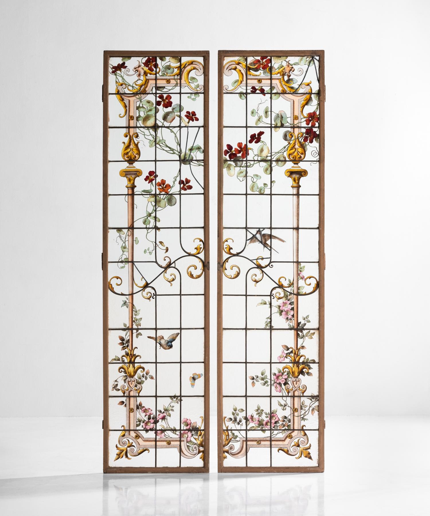 Pair of Renaissance Revival shutters, France, circa 1900

Intricate hand painted garden motif on glass panes with iron supports in original wooden shutters.