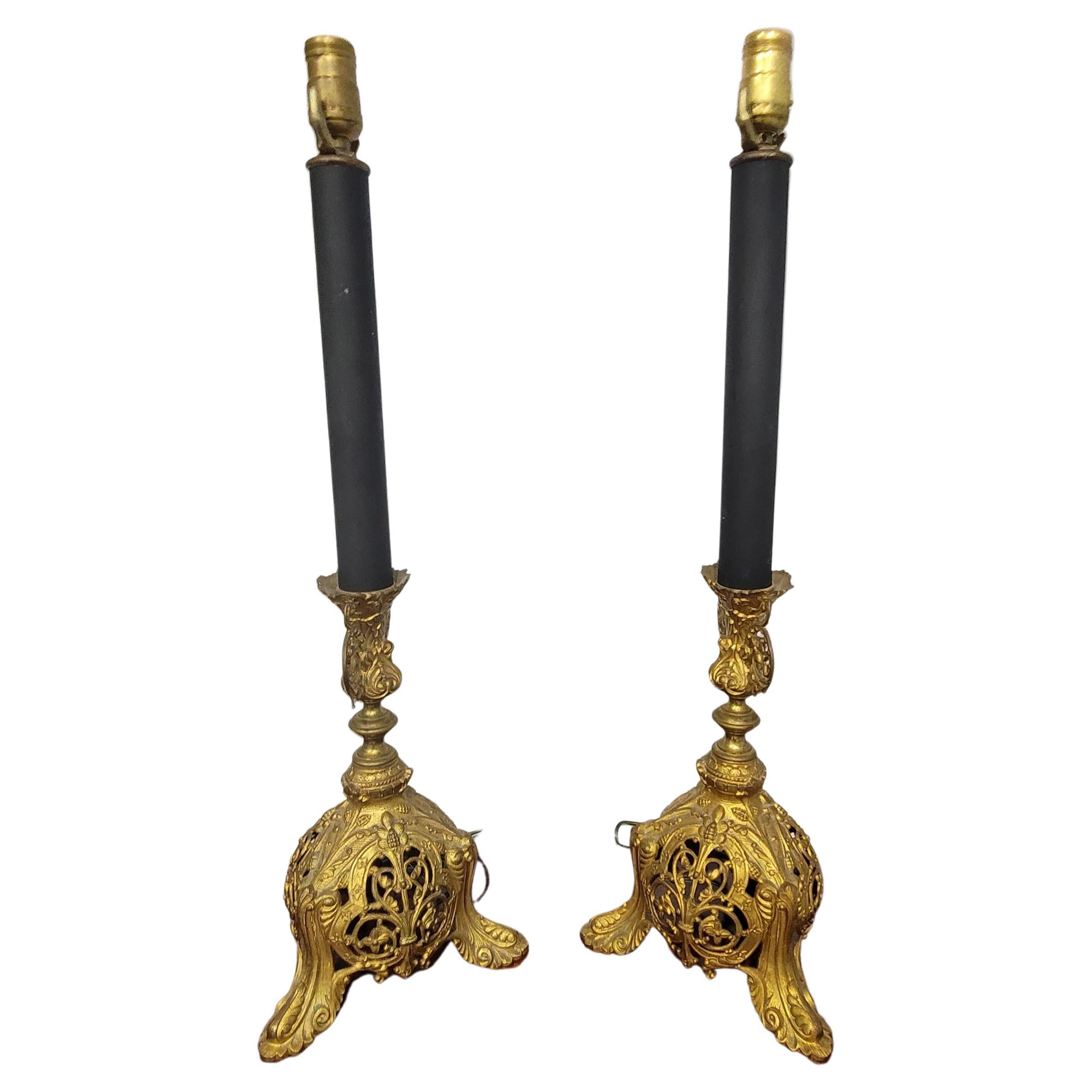 Pair of Edward F. Caldwell & Co 1851-1914 attributed renaissance revival style ormolu gilt and ebonized metal decorated table lamps, New York, early 20th century. Measure 26.25