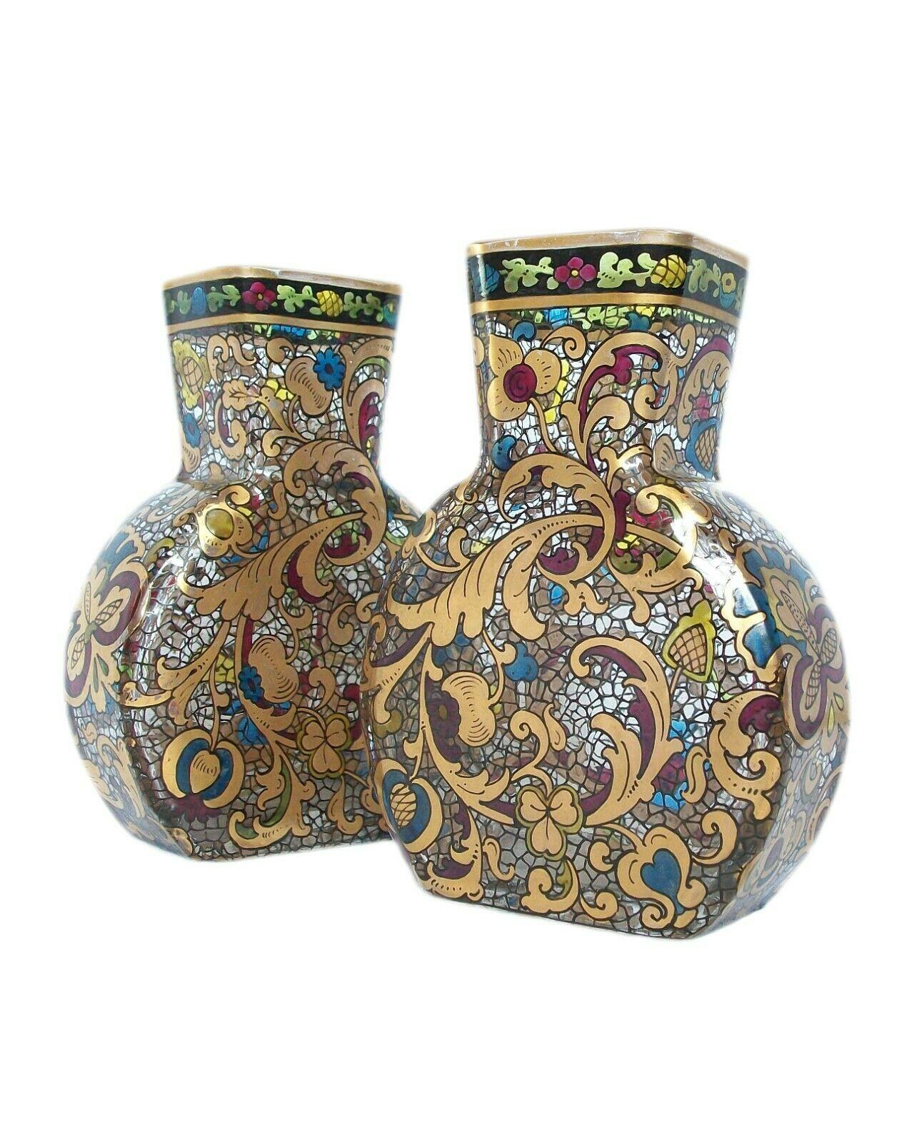 Petite pair of Renaissance style gilded and enameled glass vases - hand painted with scrolling acanthus leaves and flowers with banded borders to the top edges (resembling stained glass) - all set against a painted 'crackle' or wire work background
