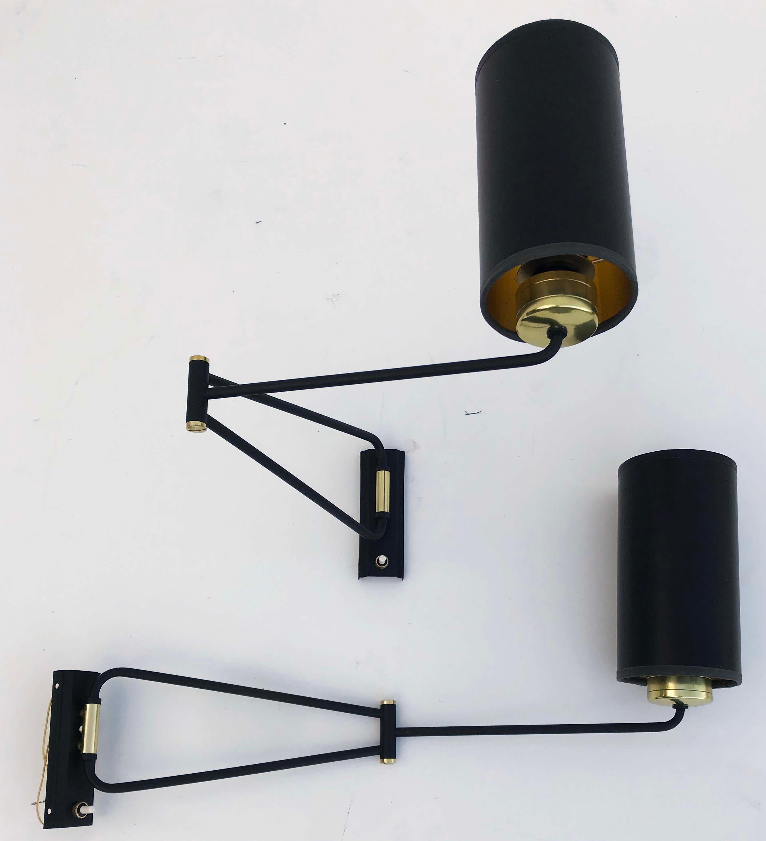 Superb pair of swing arm sconces by Rene Mathieu, adjustable sconces.
US rewired and in working condition
Totally restored and refinished
1 light, 40 watts max bulb.
Custom backplate available 
Measurements: 11