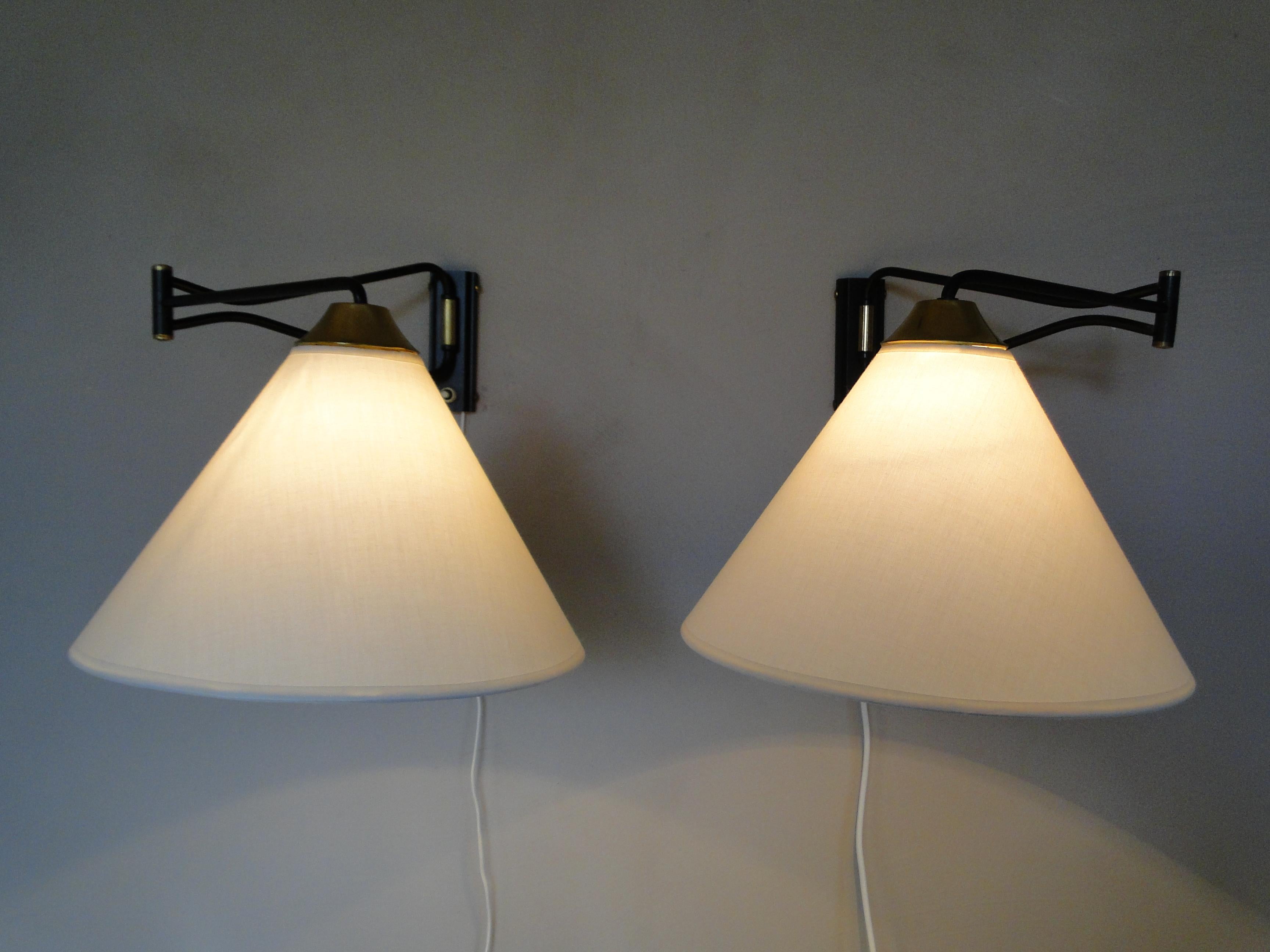 Superb pair of Swing arm sconces by Rene Mathieu, adjustable sconces.

US rewired and in working condition

Totally restored and refinished

1 light, 40 watts max bulb.



