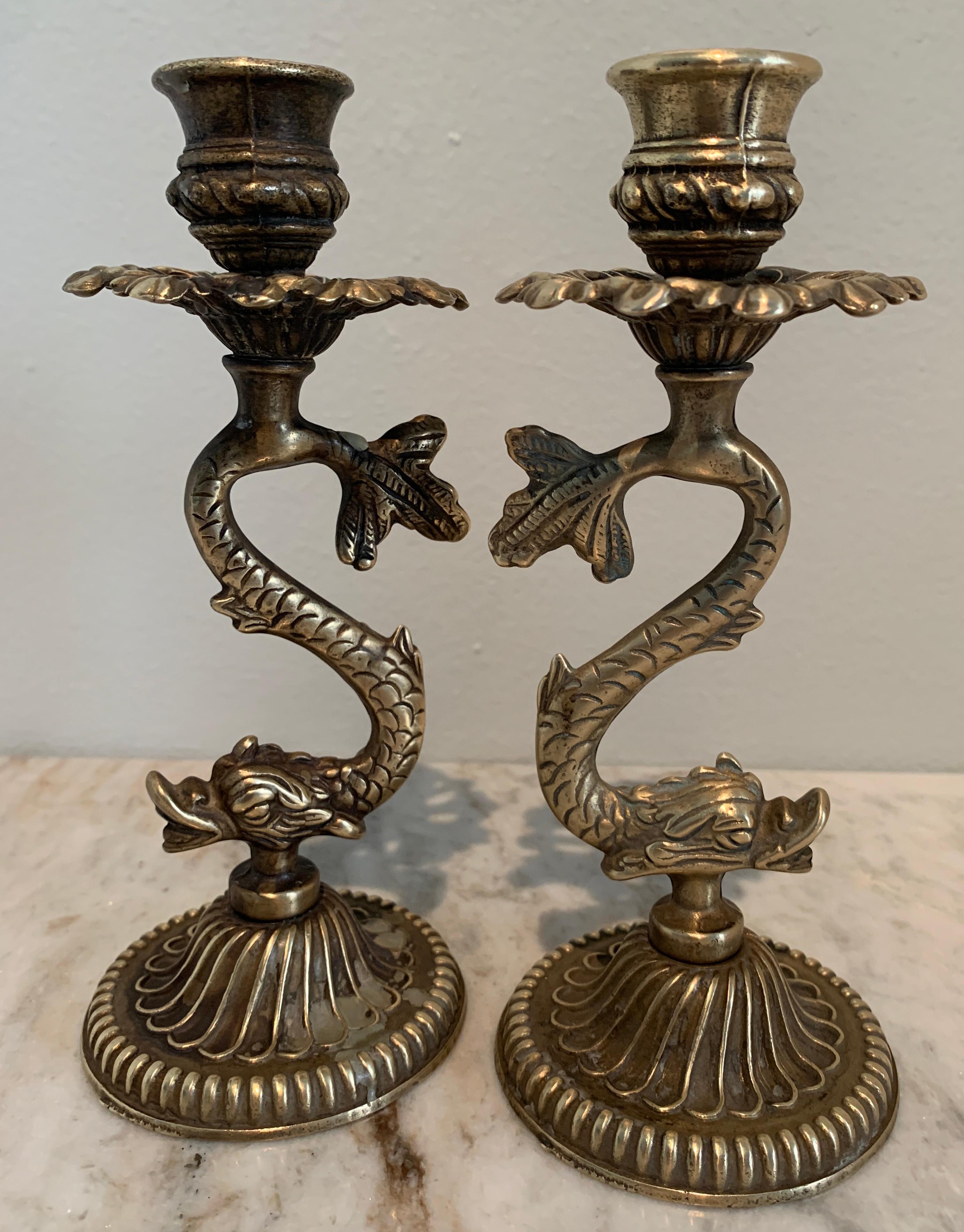 Pair of solid brass candlesticks of brass - a wonderful compliment to candlelit dinner or flanking a shelf or mantel (fireplace). Wonderful for the holidays or for a gift. A stunning pair.
