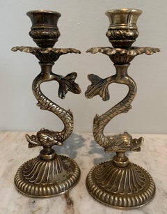 Pair of Repoussé Brass Dolphin Candlesticks
