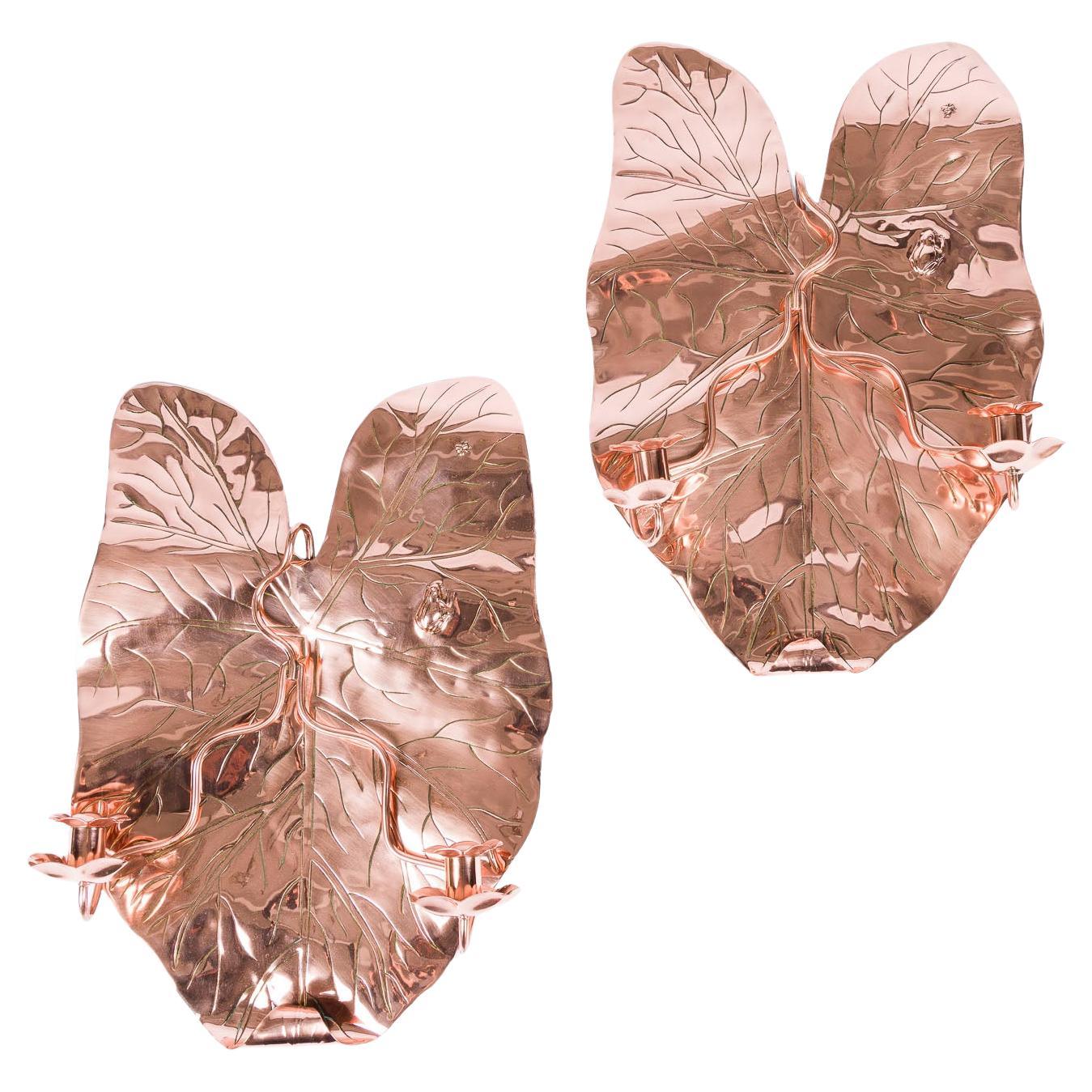 Pair of repoussé copper twin arm sconces in the form of a leaf For Sale