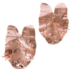 Antique Pair of repoussé copper twin arm sconces in the form of a leaf
