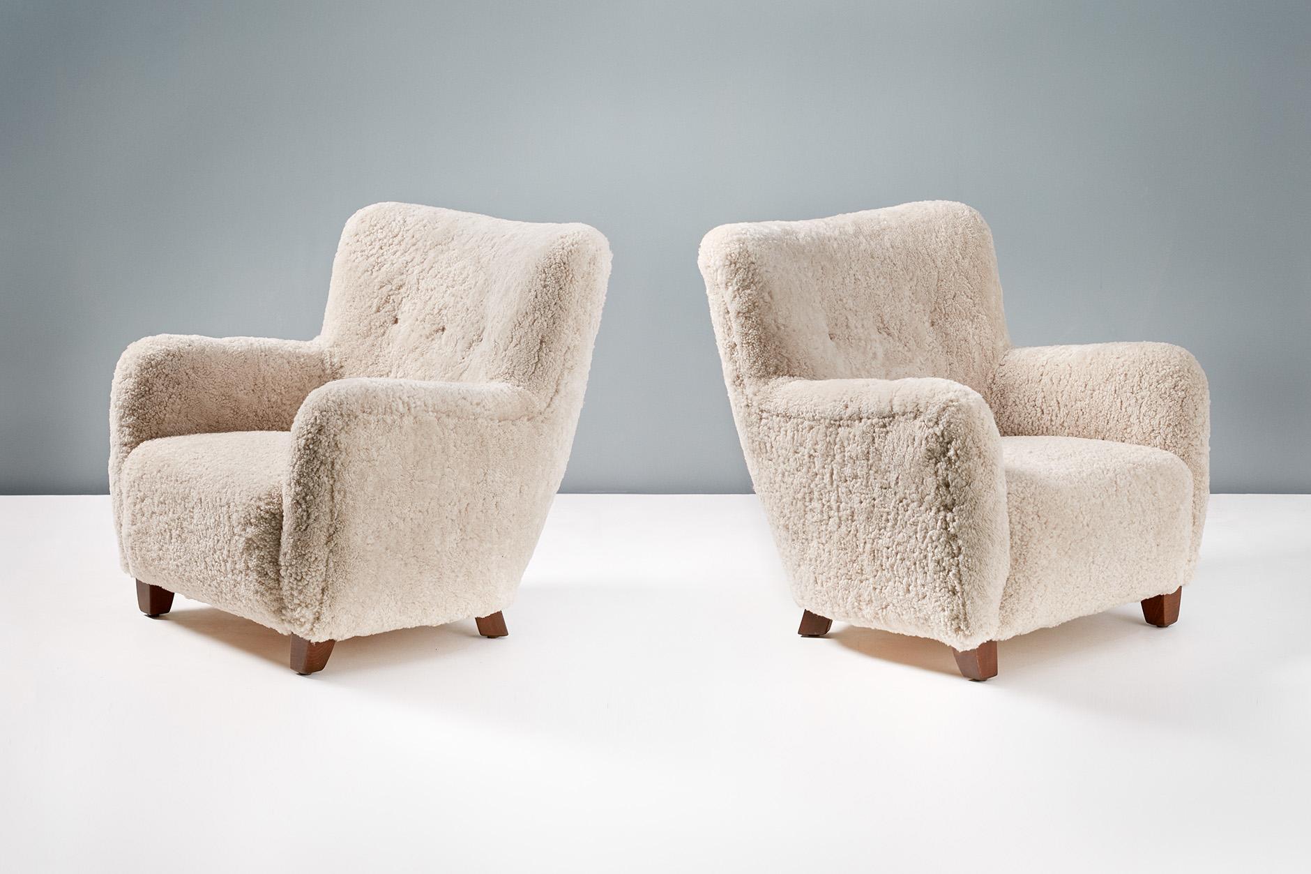 Pair of reproduction armchairs based on a design by FDB Mobler from the 1950s. 

These high-end reproductions are hand-made to order at our workshops in England. The legs are walnut-stained beechwood and the chairs have are upholstered in