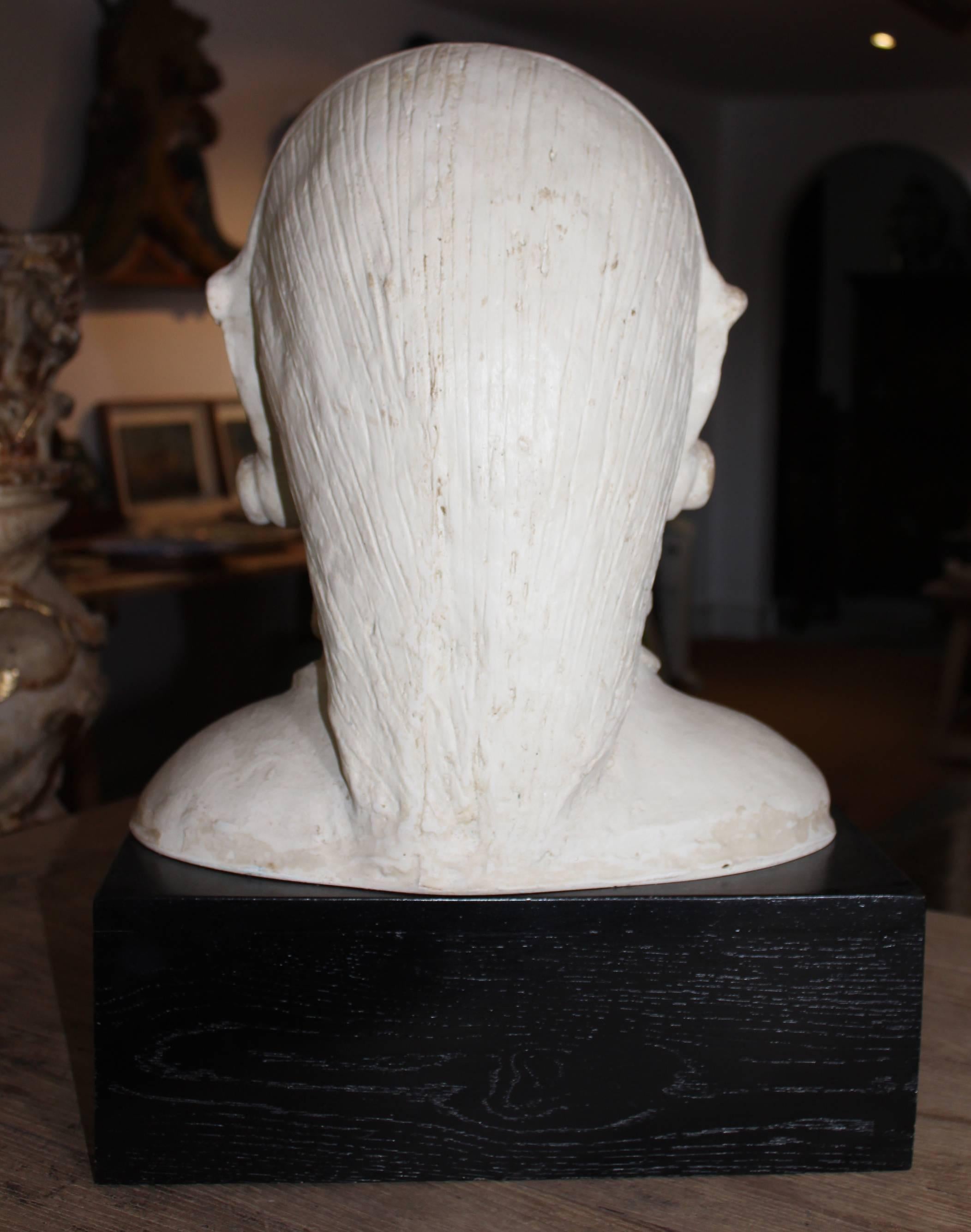 French Pair of Resin African Busts with Plaster Finish on a Black Wooden Pedestal