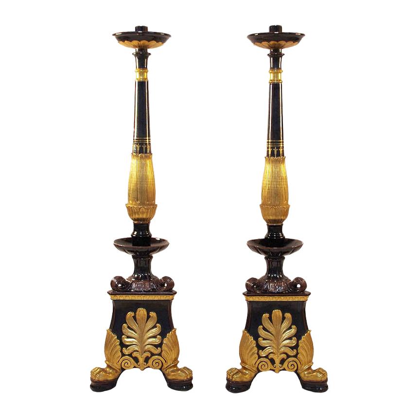 Pair of Restauration Style Torchieres in Black and Gilt Earthenware, circa 1950 For Sale
