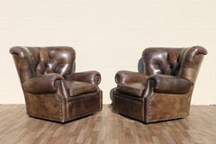 Pair of Restoration Hardware Churchill Tufted Leather Swivel Chairs